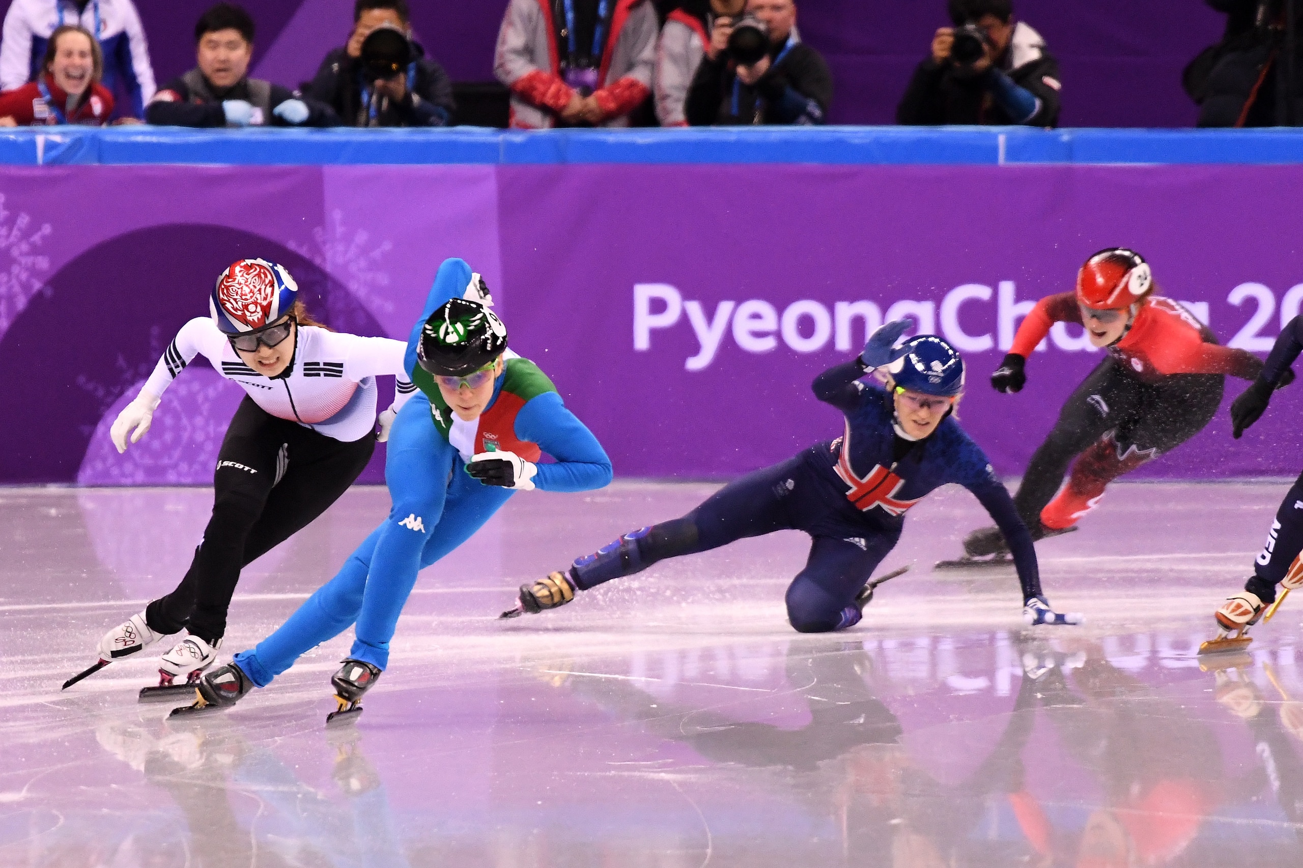GANGNEUNG, SOUTH KOREA - FEBRUARY 13:  Arianna Fontana of Italy and Minjeong Choi of Korea race past as Elise Christie of Great Britain falls during the Ladies' 500m Short Track Speed Skating final on day four of the PyeongChang 2018 Winter Olympic Games 