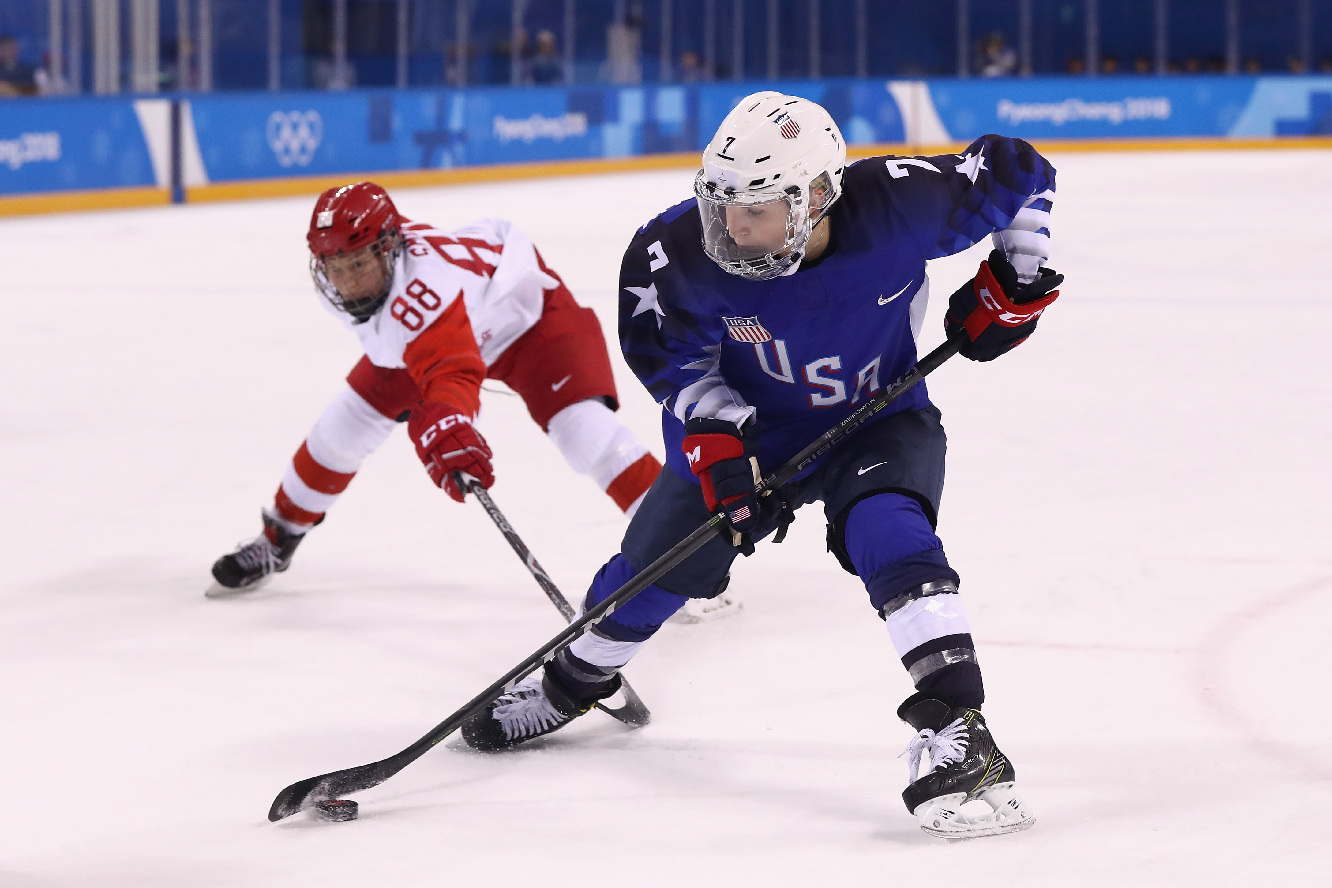 GANGNEUNG, SOUTH KOREA - FEBRUARY 13:  Monique Lamoureux-Morando #7 of the United States skates against Yekaterina Smolina #88 of Olympic Athlete from Russia in the second period during the Women's Ice Hockey Preliminary Round - Group A game on day four o