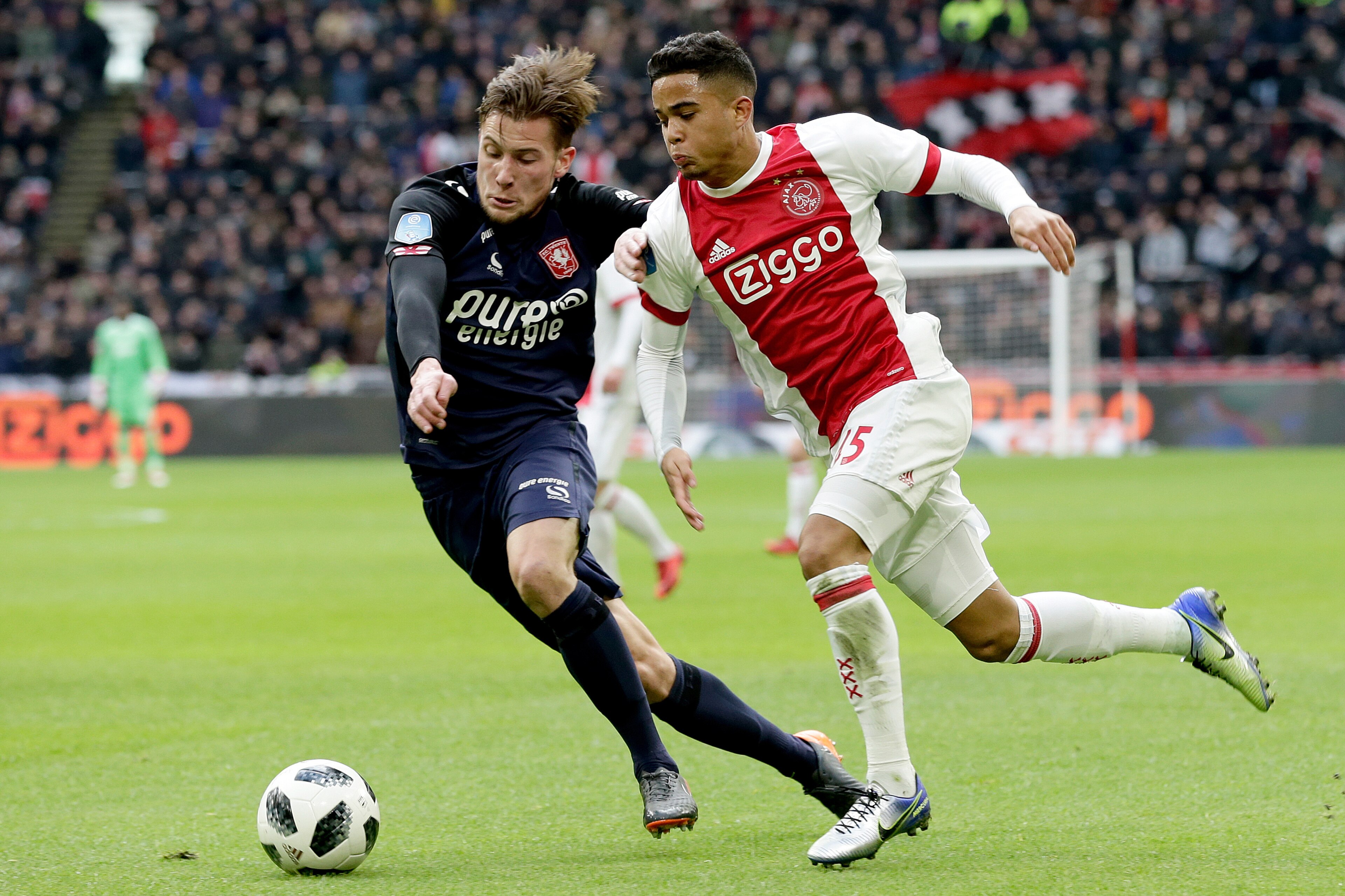 AMSTERDAM, NETHERLANDS - FEBRUARY 11: (L-R) Hidde Ter Avest of FC Twente, Justin Kluivert of Ajax  during the Dutch Eredivisie  match between Ajax v Fc Twente at the Johan Cruijff Arena on February 11, 2018 in Amsterdam Netherlands (Photo by Eric Verhoeve