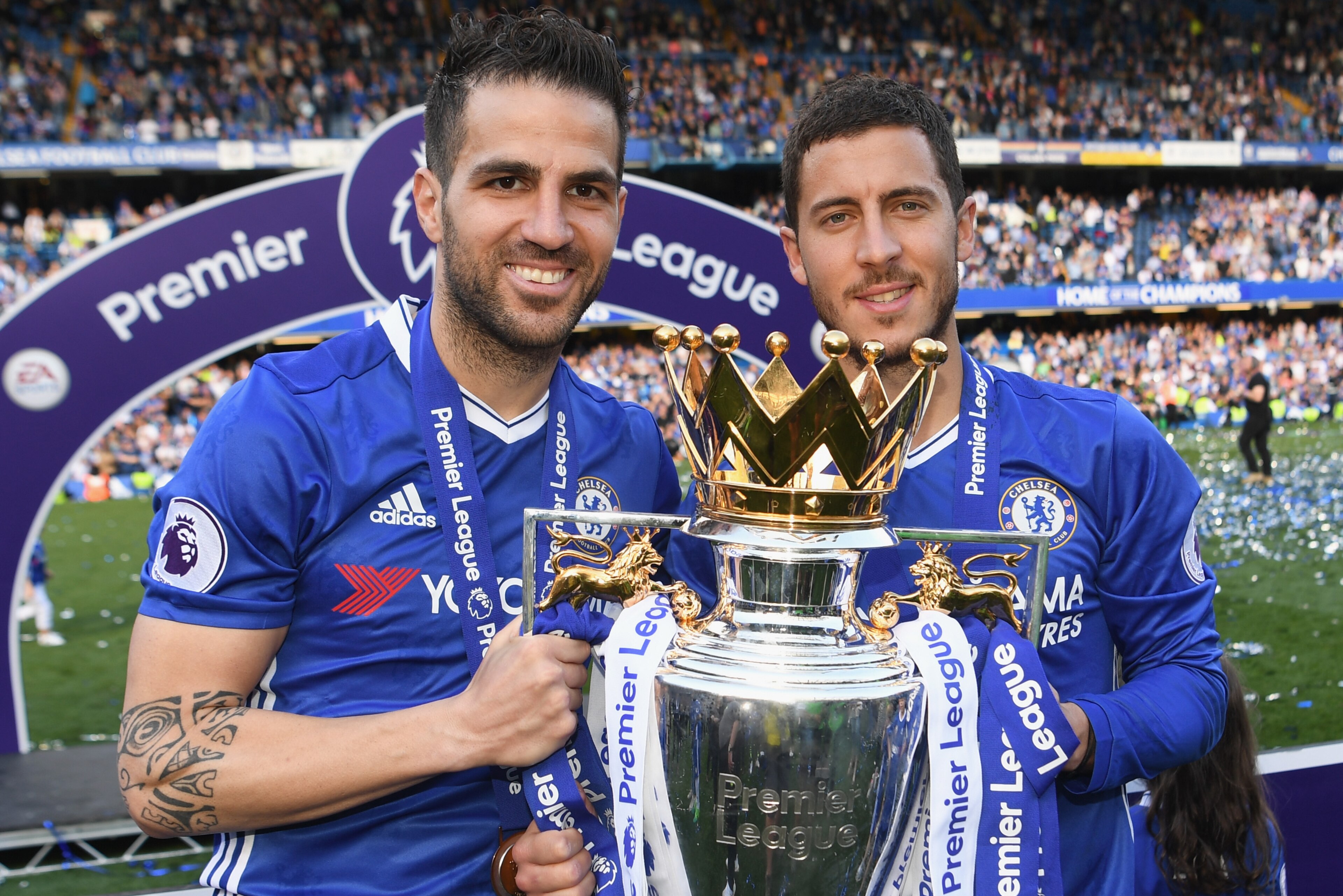 LONDON, ENGLAND - MAY 21: Cesc Fabregas and Eden Hazard of Chelsea pose with the Premier League trophy after the Premier League match between Chelsea and Sunderland at Stamford Bridge on May 21, 2017 in London, England.  (Photo by Michael Regan/Getty Imag