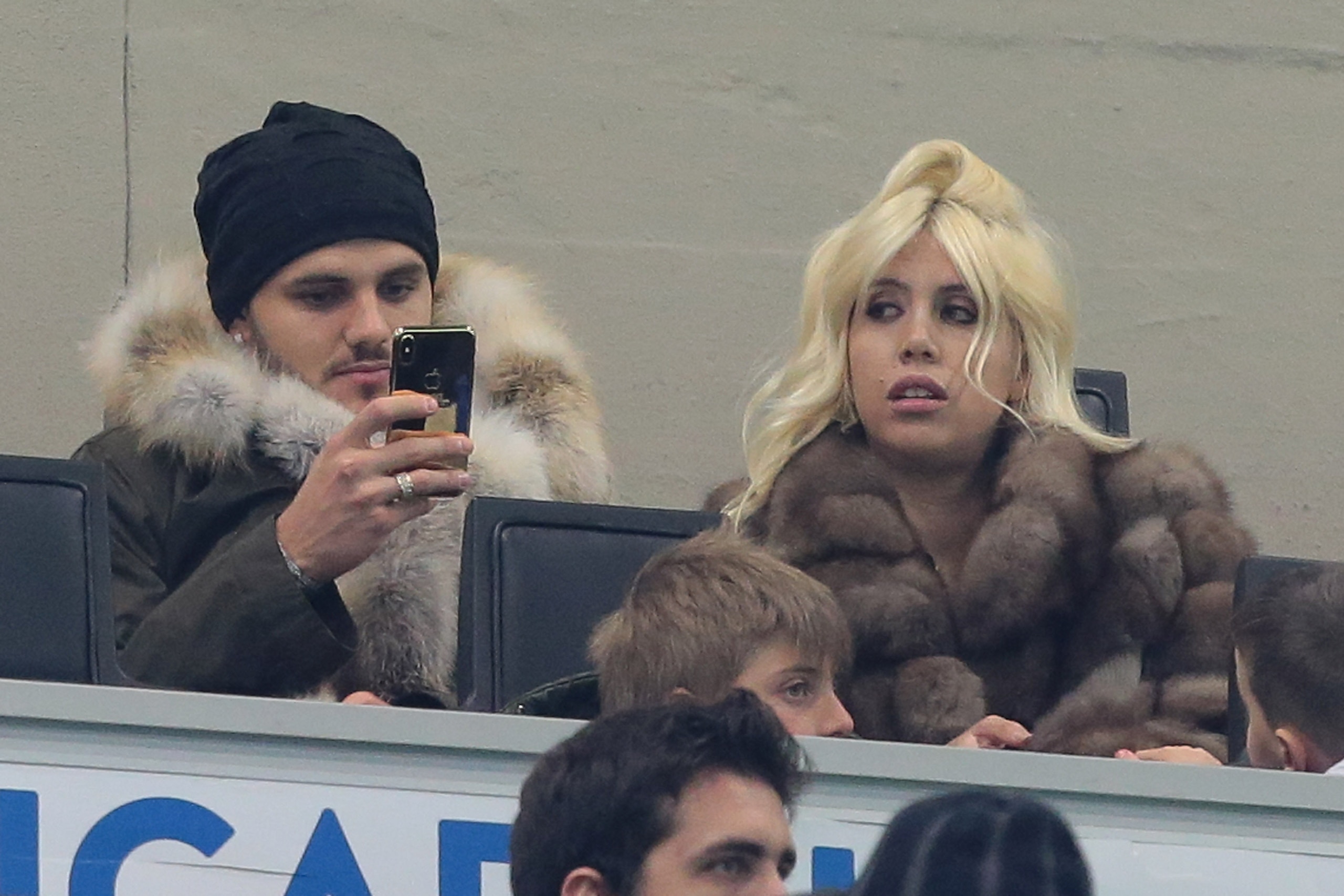 MILAN, ITALY - FEBRUARY 03:  Mauro Emanuel Icardi (L) of FC Internazionale Milano and his wife Wanda Nara attend the serie A match between FC Internazionale and FC Crotone at Stadio Giuseppe Meazza on February 3, 2018 in Milan, Italy.  (Photo by Emilio An