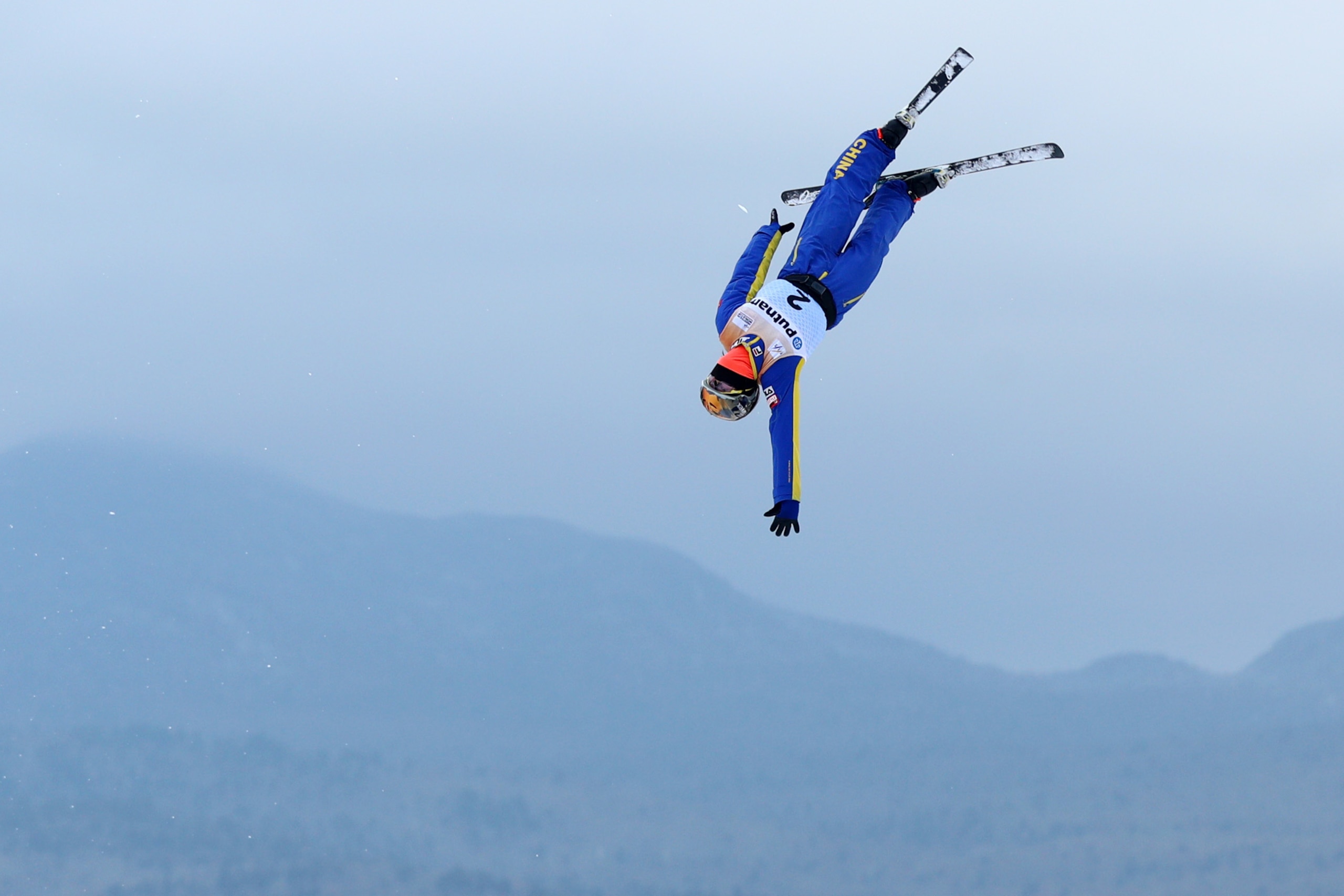 LAKE PLACID, NY - JANUARY 20: Xu Mengtao of China jumps during the Ladies Qualifying round of the Putnam Freestyle World Cup at the Lake Placid Olympic Ski Jumping Complex on January 20, 2018 in Lake Placid, New York. (Photo by Maddie Meyer/Getty Images)