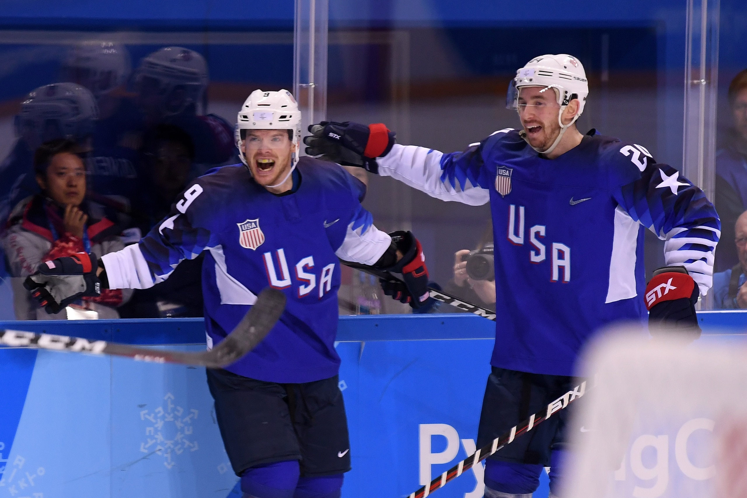 GANGNEUNG, SOUTH KOREA - FEBRUARY 14:  Brian O'Neill #9 of the United States celebrates with teammate Jonathon Blum after scoring a goal on Gasper Kroselj #32 of Slovenia in the first period during the Men's Ice Hockey Preliminary Round Group B game on da