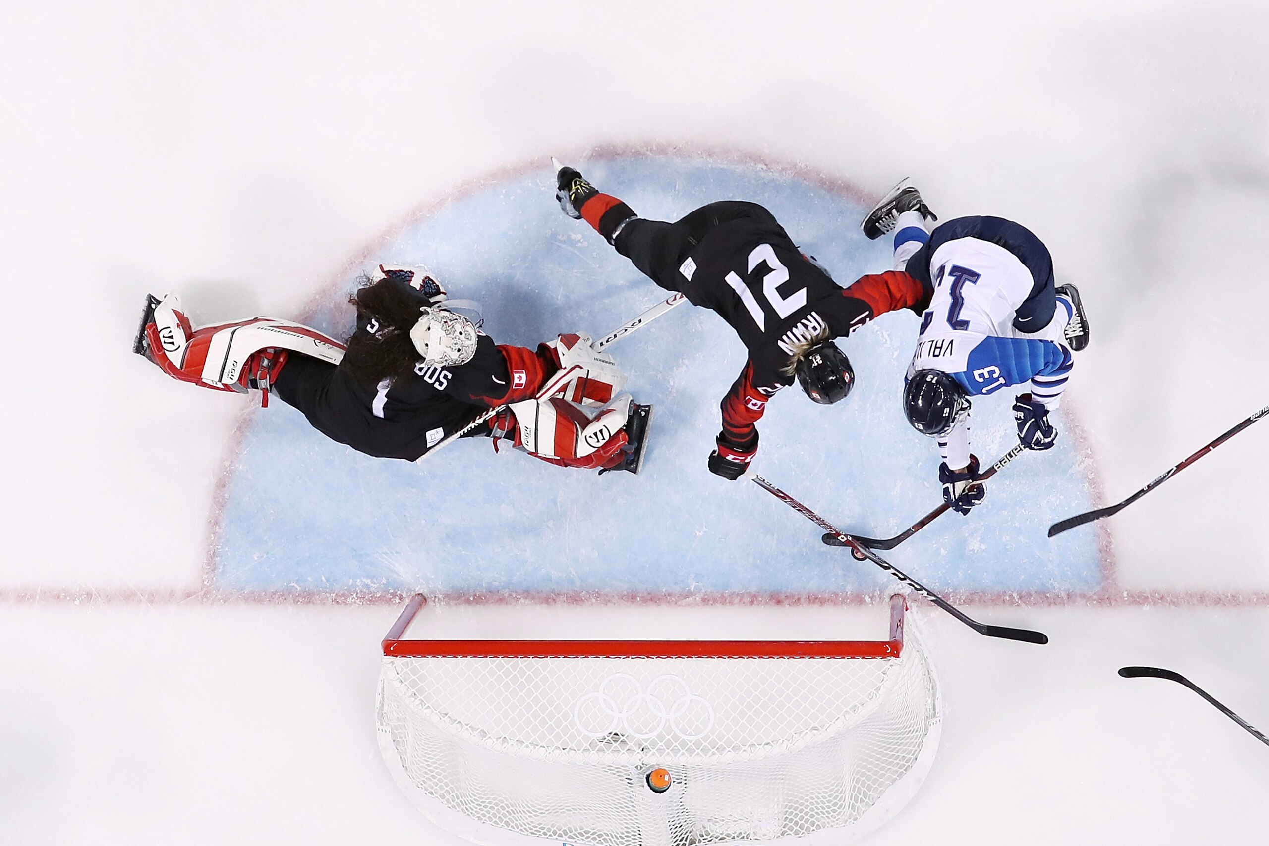 GANGNEUNG, SOUTH KOREA - FEBRUARY 13:  Riikka Valila #13 of Finland scores a goal against Shannon Szabados #1 of Canada in the third period during the Women's Ice Hockey Preliminary Round - Group A game on day four of the PyeongChang 2018 Winter Olympic G