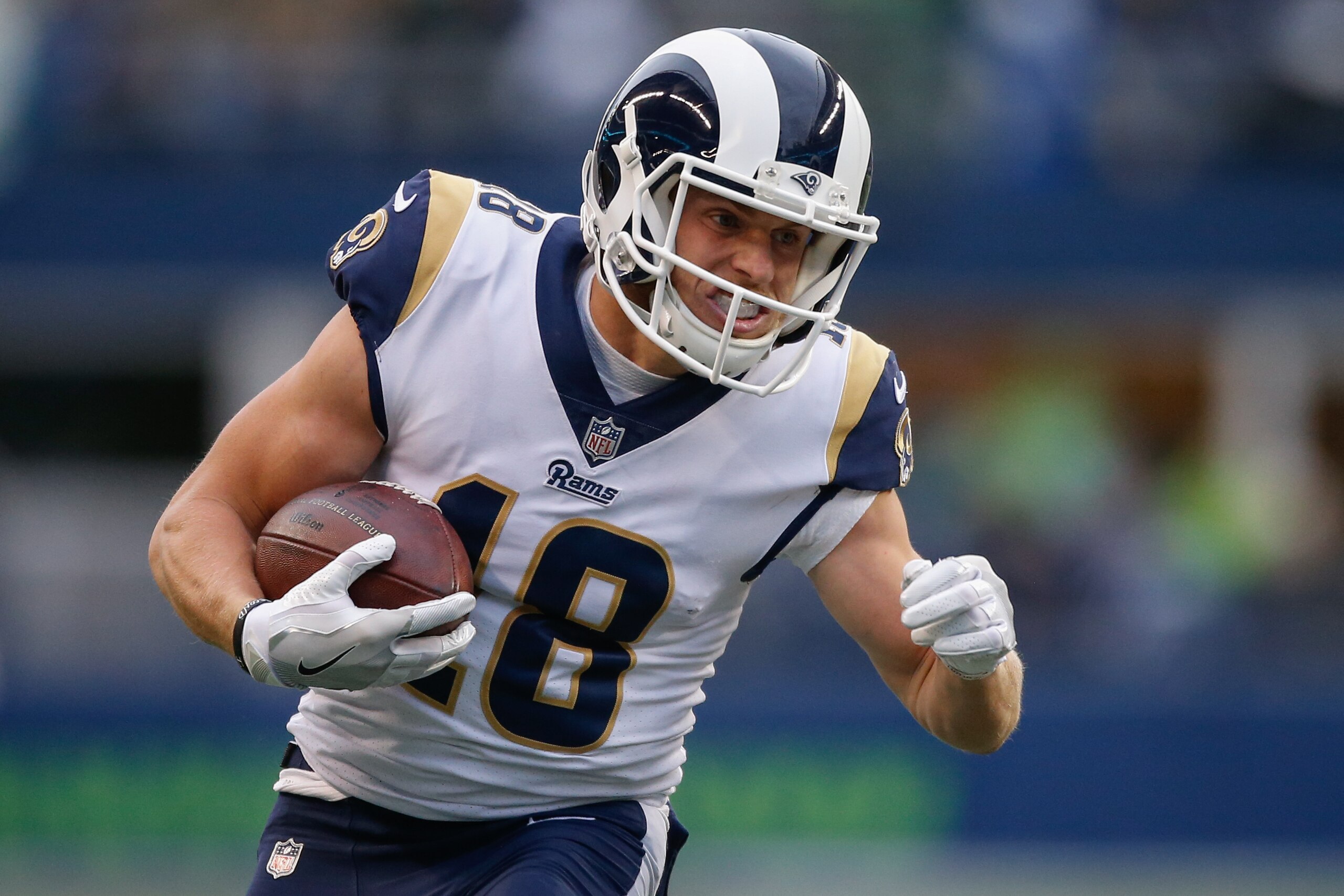 SEATTLE, WA - DECEMBER 17:  Wide receiver Cooper Kupp #18 of the Los Angeles Rams rushes against the Seattle Seahawks at CenturyLink Field on December 17, 2017 in Seattle, Washington.  (Photo by Otto Greule Jr/Getty Images)