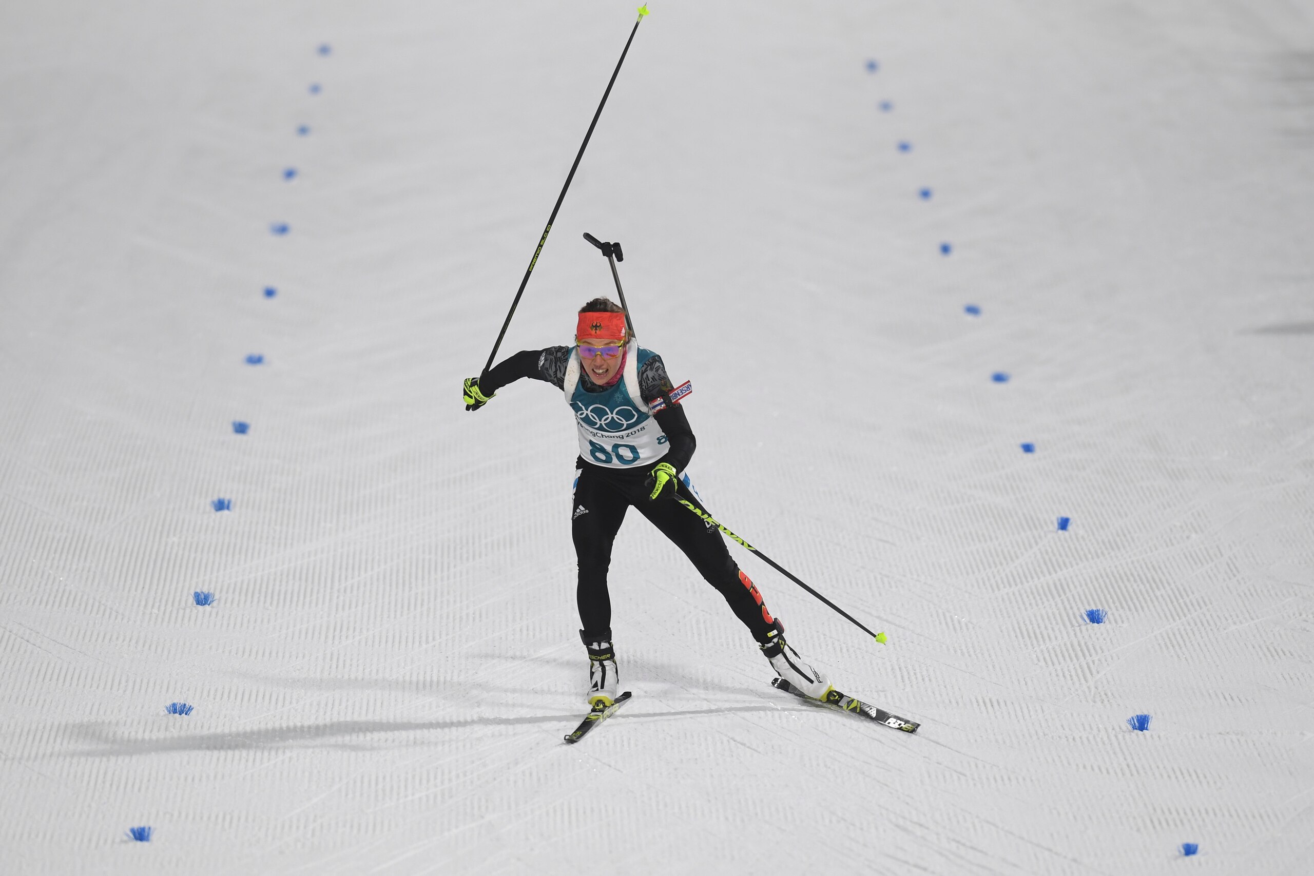 Germany's Laura Dahlmeier crosses the finish line of the women's 15km individual biathlon event at the Alpensia biathlon center during the Pyeongchang 2018 Winter Olympic Games on February 15, 2018, in Pyeongchang. / AFP PHOTO / Christof STACHE        (Ph