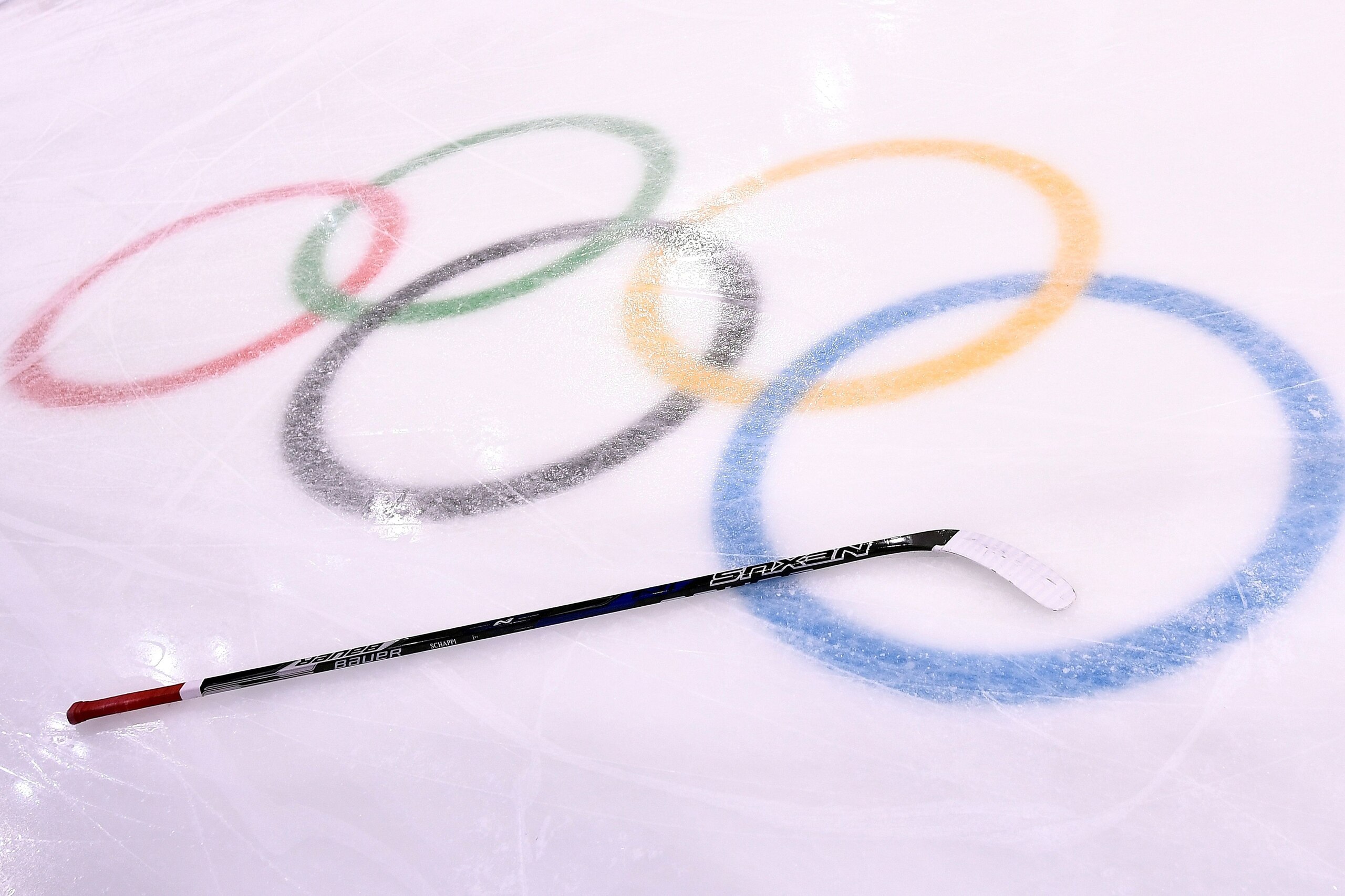 A stick is seen on the ice in the men's preliminary round ice hockey match between Switzerland and Canada during the Pyeongchang 2018 Winter Olympic Games at the Kwandong Hockey Centre in Gangneung on February 15, 2018.   / AFP PHOTO / Brendan Smialowski 