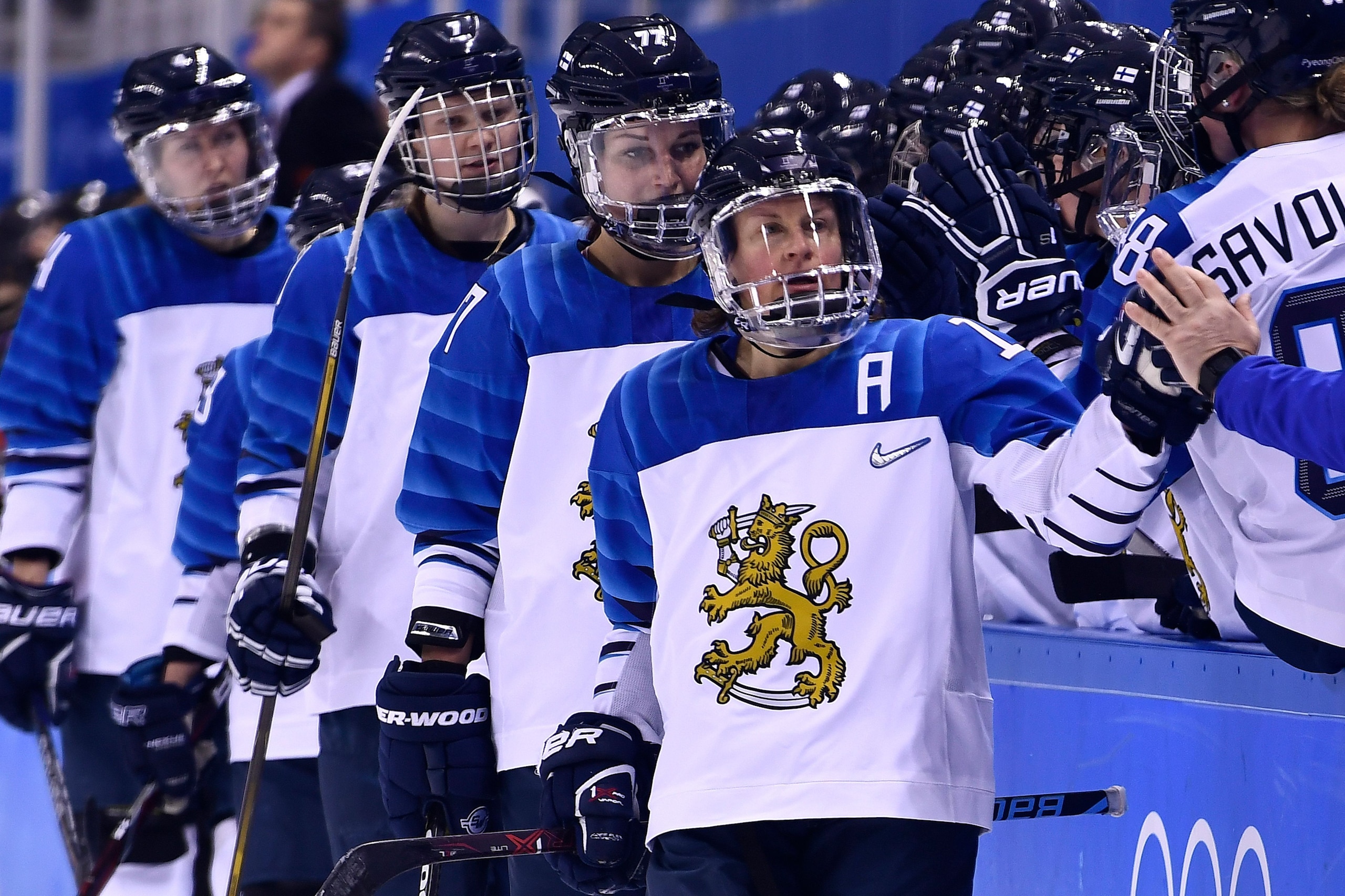 Finland's Riikka Valila celebrates with teammates after scoring a goal during the final period of the women's preliminary round ice hockey match between Canada and Finland during the Pyeongchang 2018 Winter Olympic Games at the Kwandong Hockey Centre in G