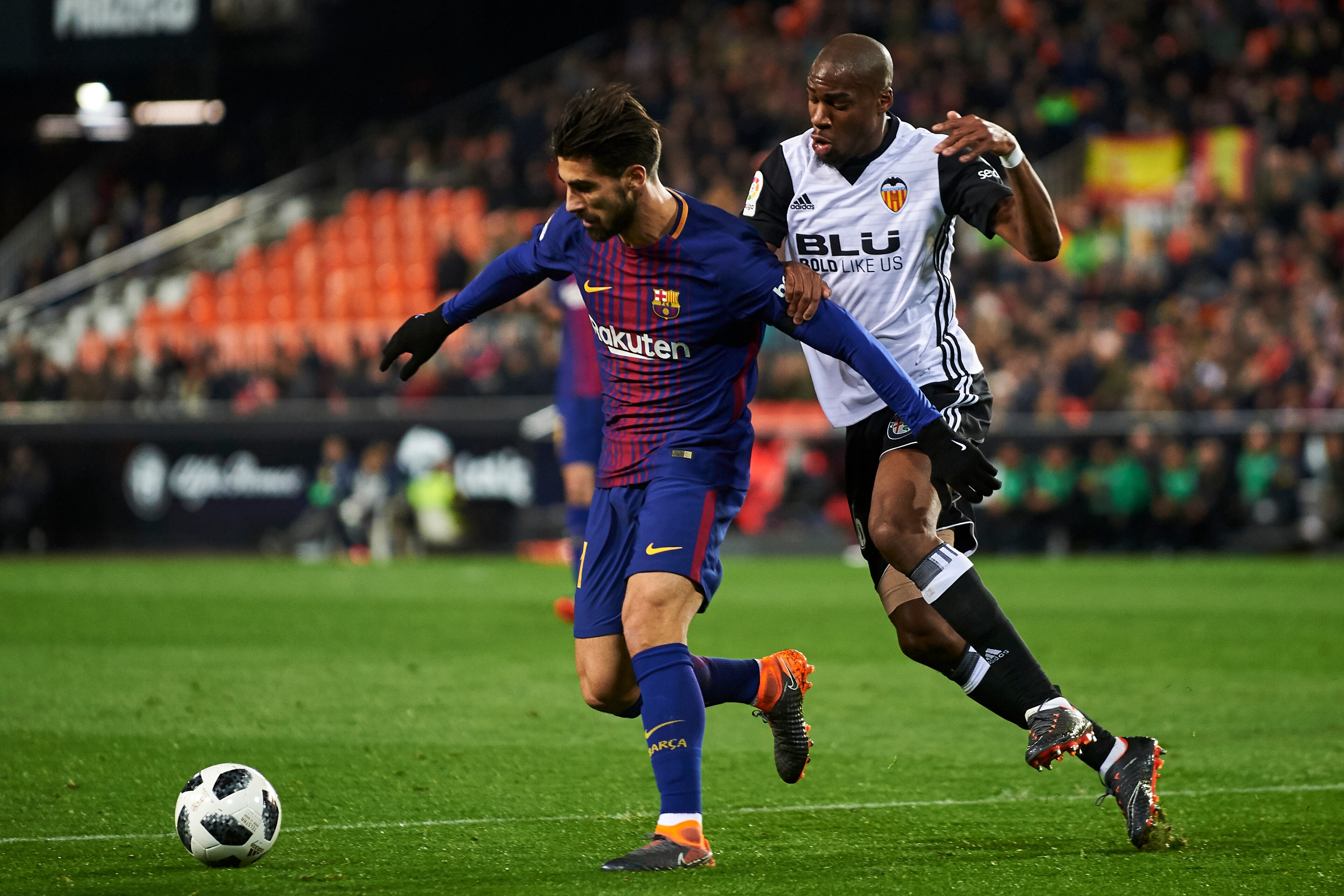 VALENCIA, SPAIN - FEBRUARY 08:  Andre Gomes of FC Barcelona is challenged by Geoffrey Kondogbia of Valencia CF during the Copa de Rey semi-final second leg match between Valencia and Barcelona on February 8, 2018 in Valencia, Spain.  (Photo by Manuel Quei