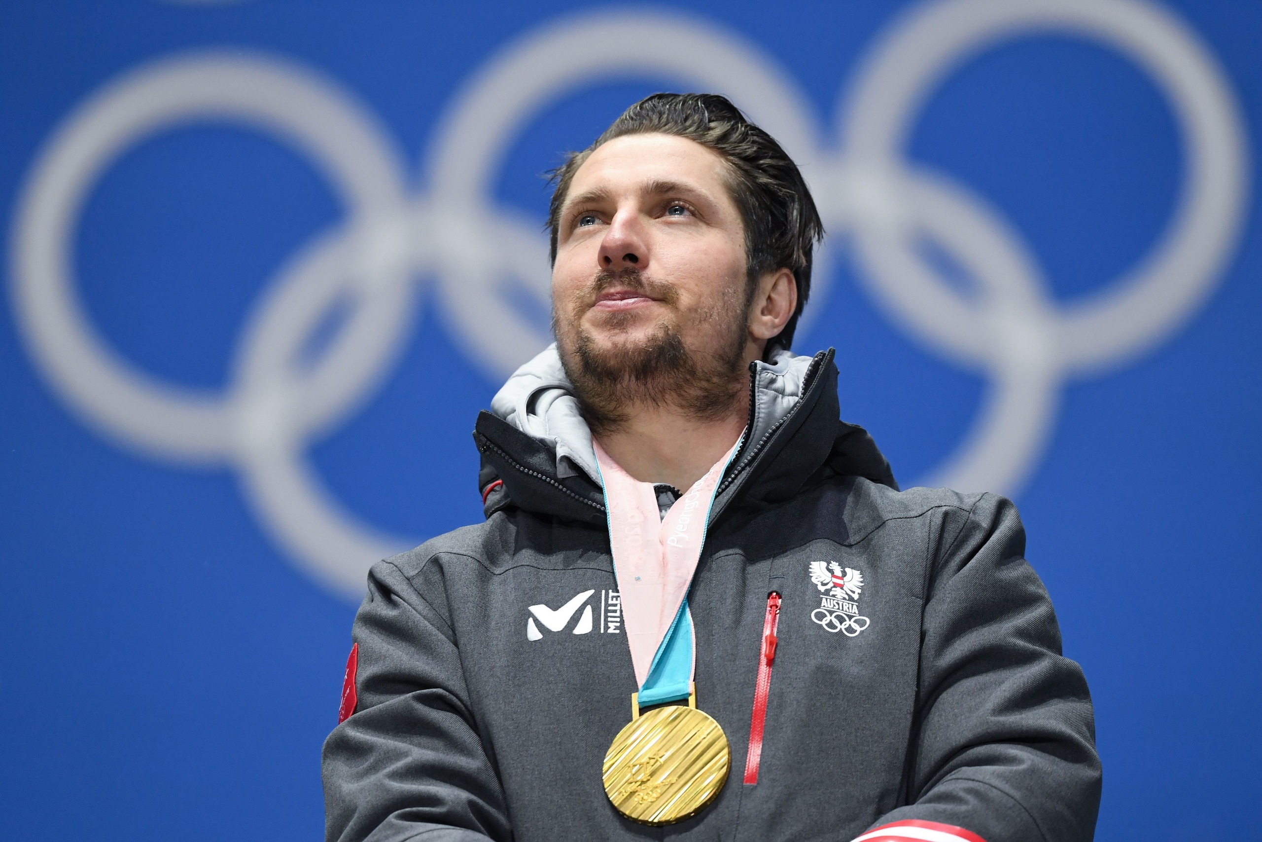 Austria's gold medallist Marcel Hirscher poses on the podium during the medal ceremony for the Men's alpine skiing combined at the Pyeongchang Medals Plaza during the Pyeongchang 2018 Winter Olympic Games in Pyeongchang on February 13, 2018. / AFP PHOTO /