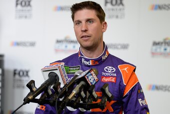DAYTONA BEACH, FL - FEBRUARY 14:  Denny Hamlin, driver of the #11 FedEx Express Toyota, talks to the media during the Daytona 500 Media Day at Daytona International Speedway on February 14, 2018 in Daytona Beach, Florida.  (Photo by Robert Laberge/Getty I