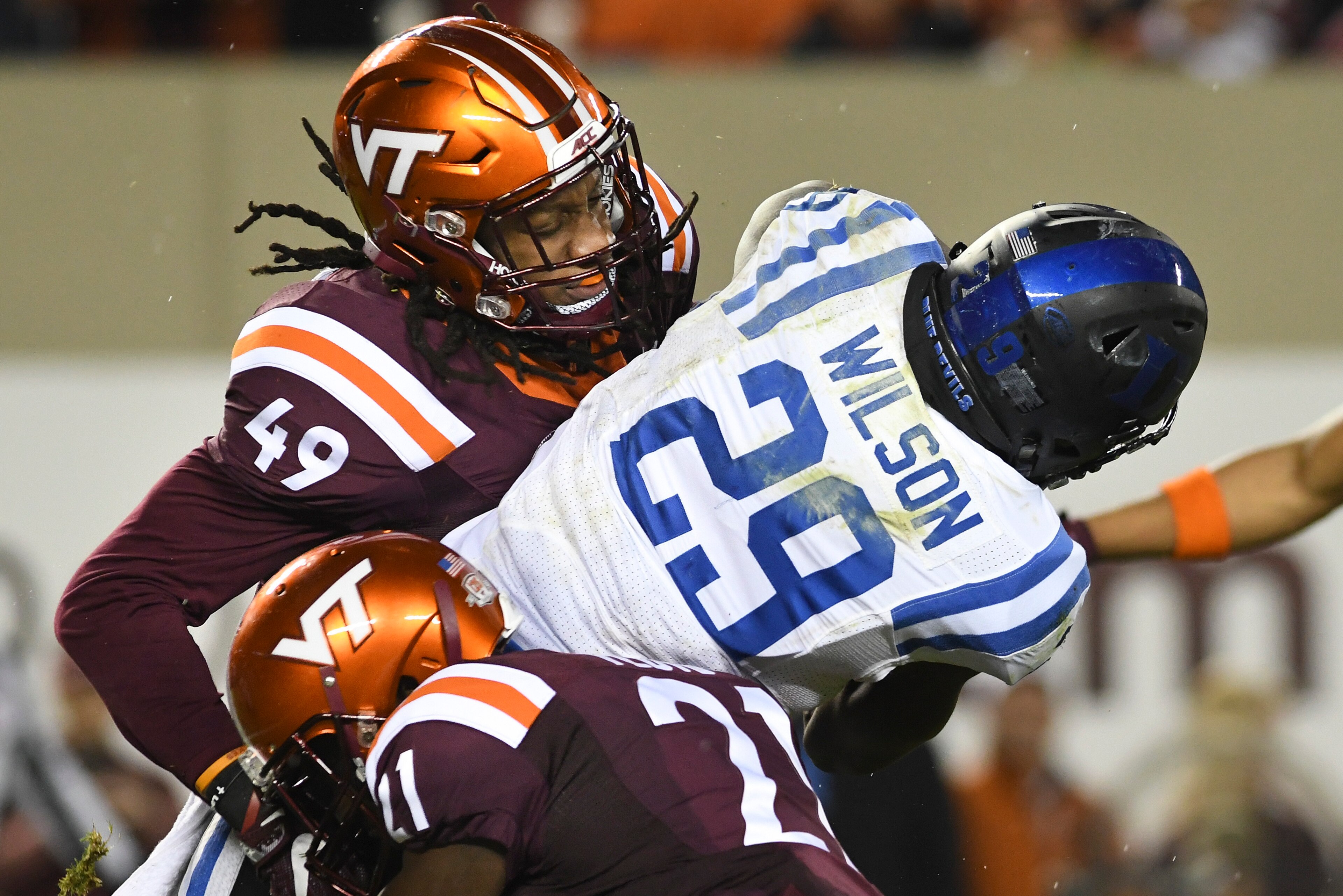 BLACKSBURG, VA - OCTOBER 28: Linebacker Tremaine Edmunds #49 and safety Reggie Floyd #21 of the Virginia Tech Hokies tackle running back Shaun Wilson #29 of the Duke Blue Devils in the first half at Lane Stadium on October 28, 2017 in Blacksburg, Virginia BLACKSBURG, VA - OCTOBER 28: Linebacker Tremaine Edmunds #49 and safety Reggie Floyd #21 of the Virginia Tech Hokies tackle running back Shaun Wilson #29 of the Duke Blue Devils in the first half at Lane Stadium on October 28, 2017 in Blacksburg, Virginia