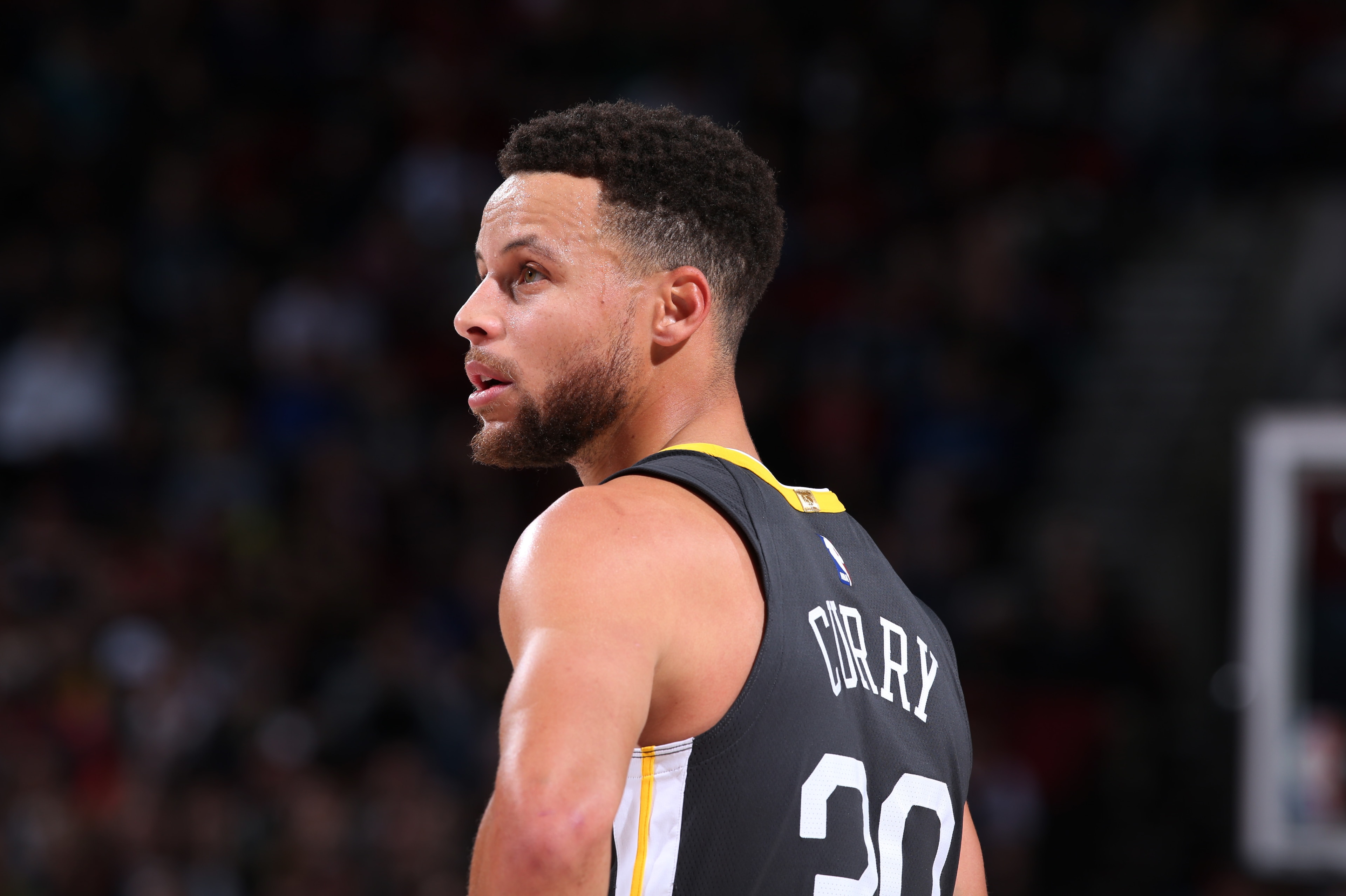 PORTLAND, OR - FEBRUARY 14:  Stephen Curry #30 of the Golden State Warriors looks on during the game against the Portland Trail Blazers on February 14, 2018 at the Moda Center Arena in Portland, Oregon. NOTE TO USER: User expressly acknowledges and agrees