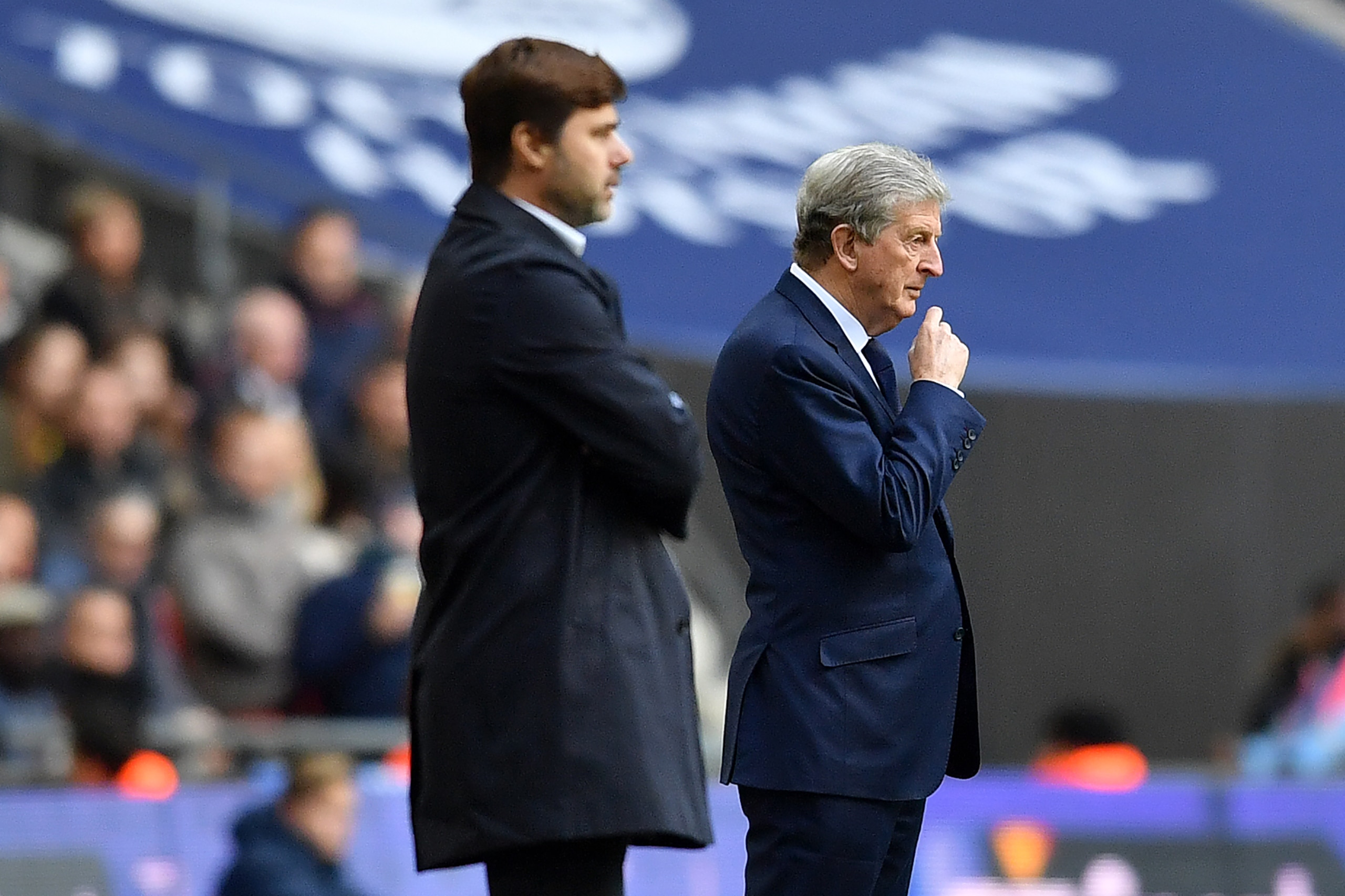 Tottenham Hotspur's Argentinian head coach Mauricio Pochettino and Crystal Palace's English manager Roy Hodgson watches his players from the touchline during the English Premier League football match between Tottenham Hotspur and Crystal Palace at Wembley