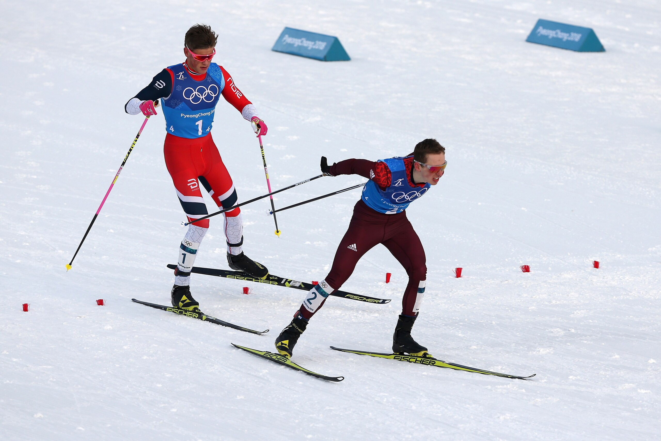 PYEONGCHANG-GUN, SOUTH KOREA - FEBRUARY 18:  Denis Spitsov of Olympic Athlete from Russia and Johannes Hoesflot Klaebo of Norway compete in the fourth leg during Cross-Country Skiing men's 4x10km relay on day nine of the PyeongChang 2018 Winter Olympic Ga