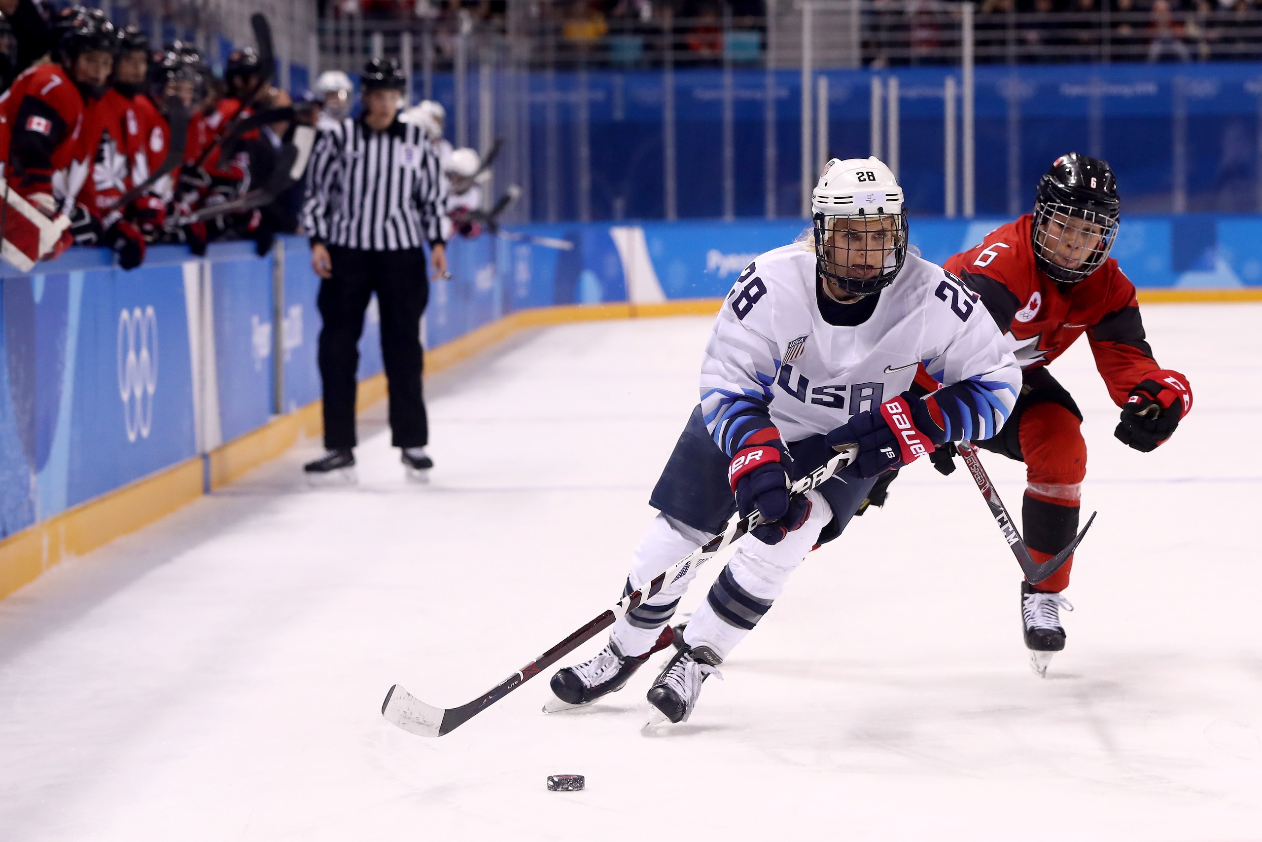 GANGNEUNG, SOUTH KOREA - FEBRUARY 15: Amanda Kessel #28 of the United States controls the puck against Rebecca Johnston #6 of Canada during the Women's Ice Hockey Preliminary Round Group A game on day six of the PyeongChang 2018 Winter Olympic Games at Kw