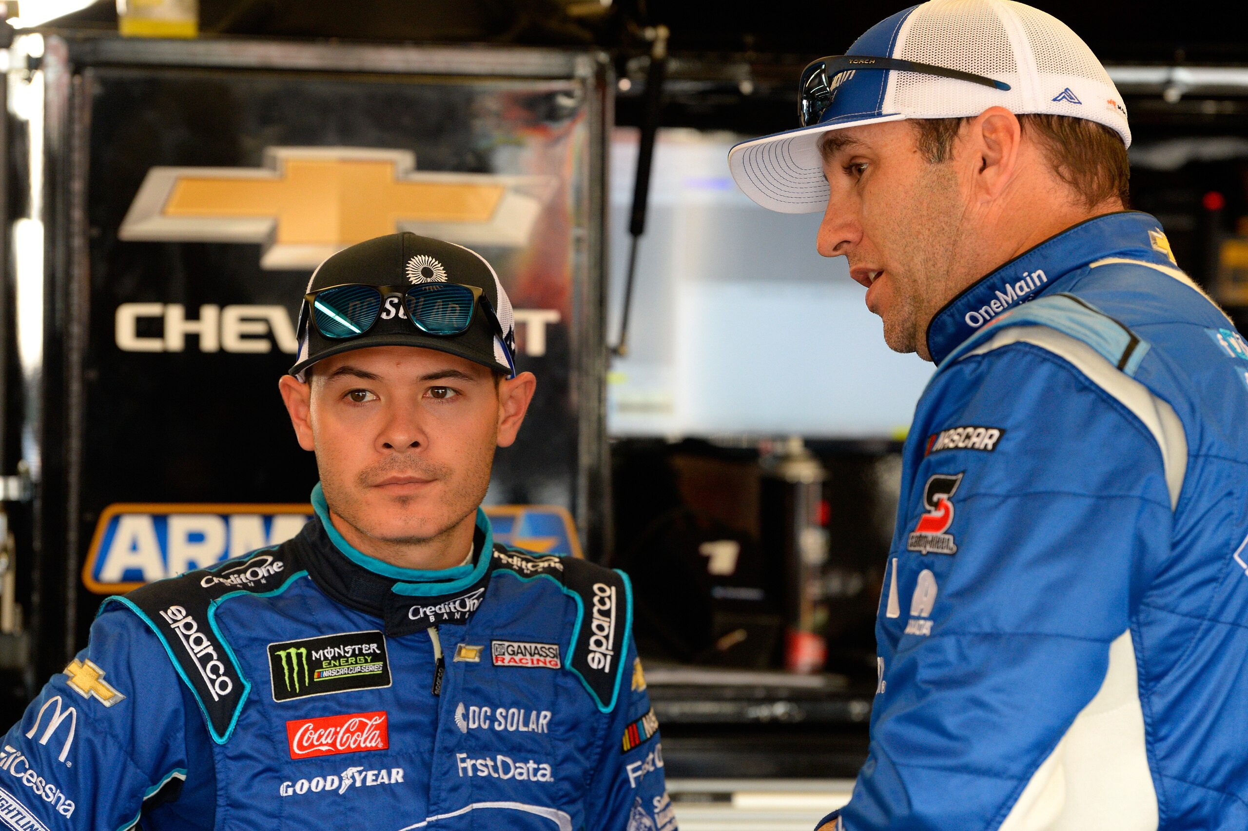 DAYTONA BEACH, FL - FEBRUARY 16: Kyle Larson, driver of the #42 DC Solar Chevrolet, talks with Elliott Sadler, driver of the #1 OneMain Financial Chevrolet, during practice for the NASCAR Xfinity Series PowerShares QQQ 300 at Daytona International Speedw DAYTONA BEACH, FL - FEBRUARY 16: Kyle Larson, driver of the #42 DC Solar Chevrolet, talks with Elliott Sadler, driver of the #1 OneMain Financial Chevrolet, during practice for the NASCAR Xfinity Series PowerShares QQQ 300 at Daytona International Speedw