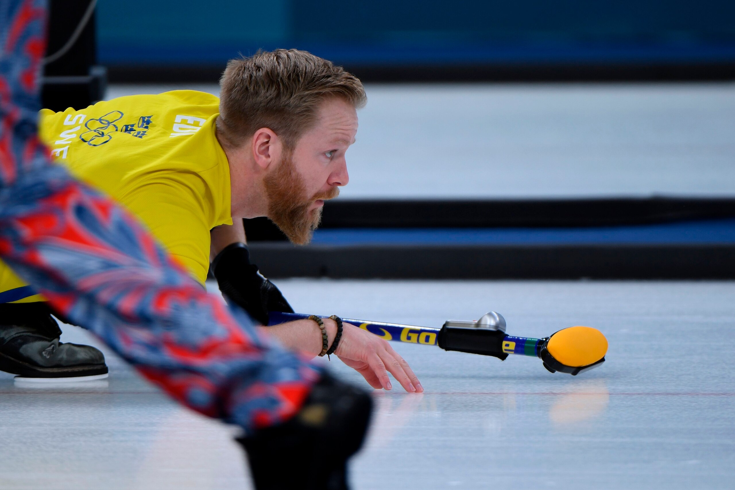 Sweden's Niklas Edin watches the stone during the curling men's round robin session between Canada and Sweden during the Pyeongchang 2018 Winter Olympic Games at the Gangneung Curling Centre in Gangneung on February 17, 2018. / AFP PHOTO / WANG Zhao      