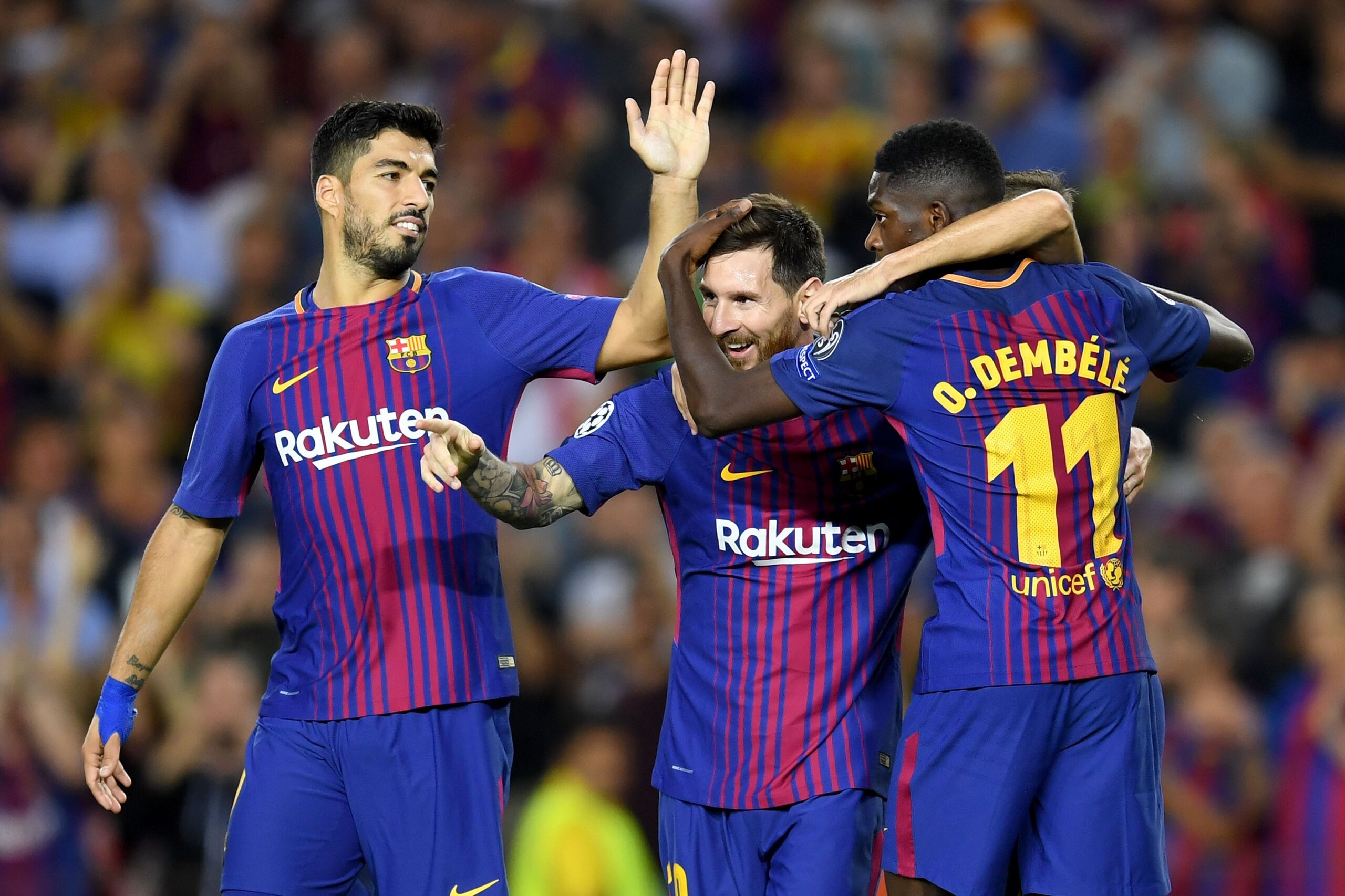 BARCELONA, SPAIN - SEPTEMBER 12:  Lionel Messi of Barcelona celebrates scoring his sides third goal with Ousmane Dembele of Barcelona and Luis Suarez of Barcelona during the UEFA Champions League Group D match between FC Barcelona and Juventus at Camp Nou
