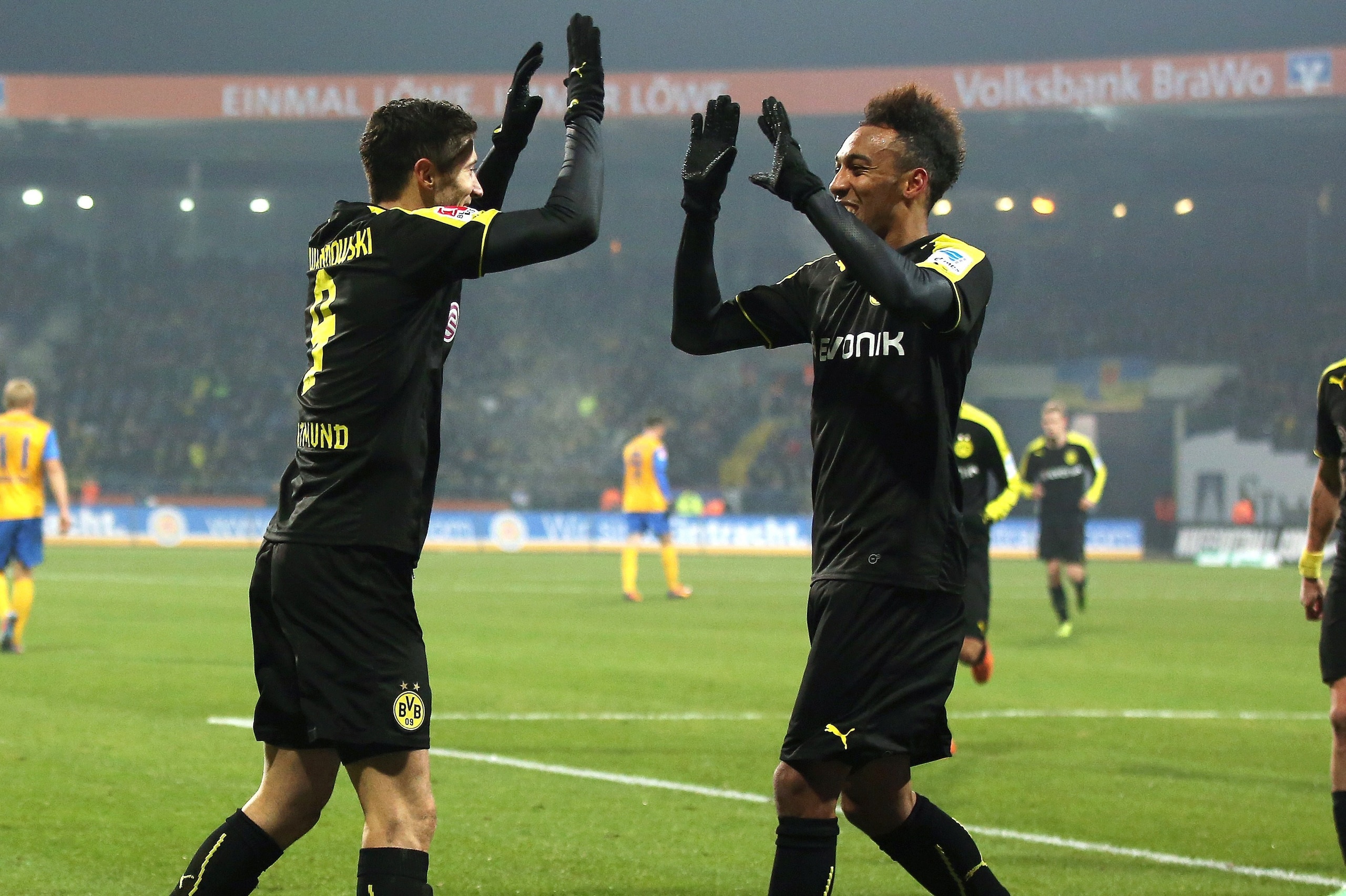 Dortmund's Polish striker Robert Lewandowski (L) and Dortmund's Gabonese striker Pierre-Emerick Aubameyang celebrate their teams first goal during the German first division Bundesliga football match Eintracht Braunschweig vs Borussia Dortmund in Braunschw