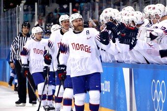 GANGNEUNG, SOUTH KOREA - FEBRUARY 16:  Patrick Thoresen #41 of Norway celebrates with teammates after scoring a goal on Mikko Koskinen #19 of Finland in the first period during the Men's Ice Hockey Preliminary Round Group C game at Gangneung Hockey Centre