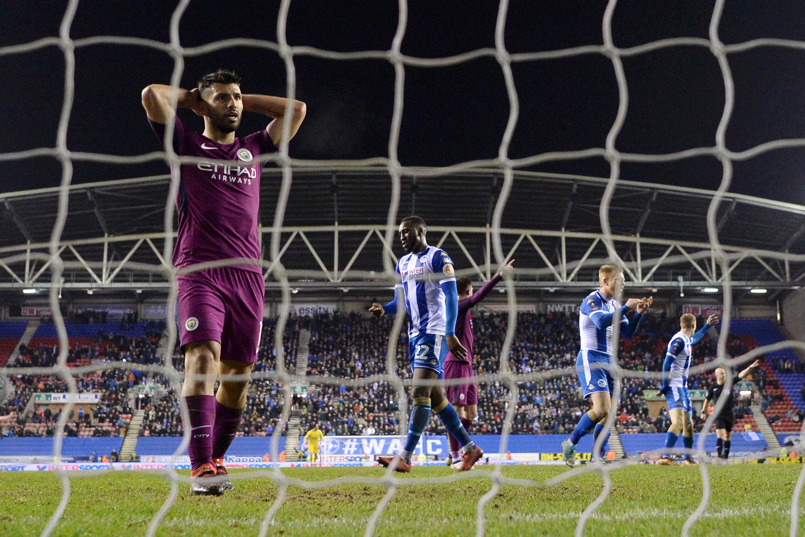 WIGAN, ENGLAND - FEBRUARY 19:  Sergio Aguero of Manchester City looks dejected during the Emirates FA Cup Fifth Round match between Wigan Athletic and Manchester City at DW Stadium on February 19, 2018 in Wigan, England.  (Photo by Gareth Copley/Getty Ima