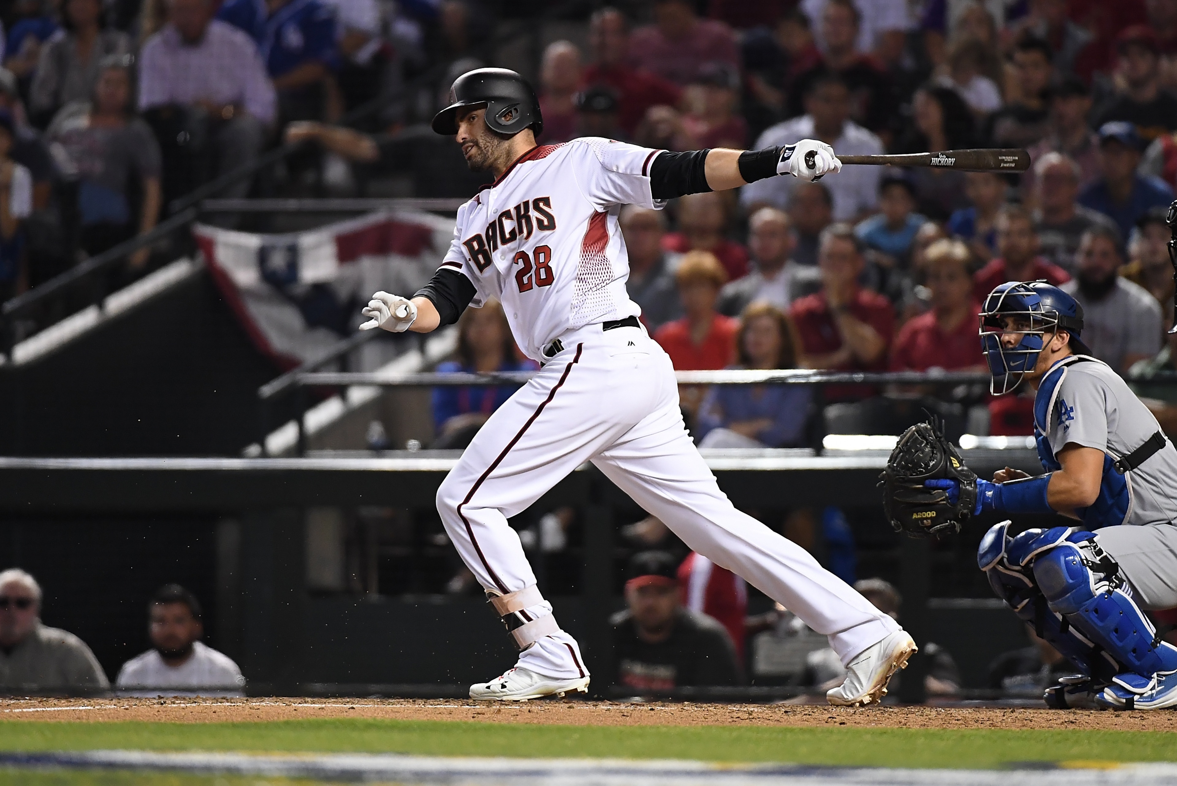 PHOENIX, AZ - OCTOBER 09:  JD Martinez #28 of the Arizona Diamondbacks follows through on a swing during game three of the National League Divisional Series against the Los Angeles Dodgers at Chase Field on October 9, 2017 in Phoenix, Arizona.  (Photo by 