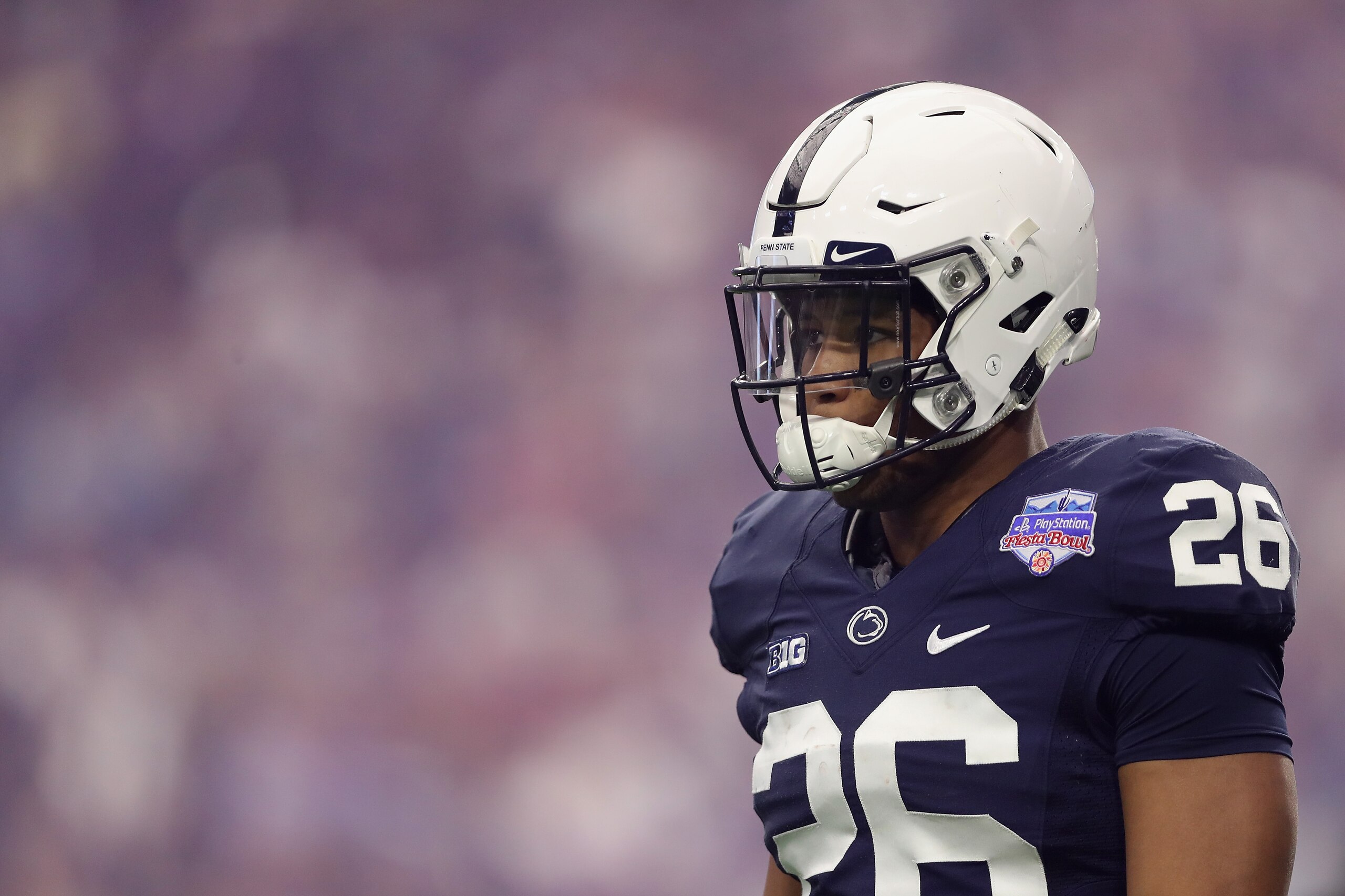 GLENDALE, AZ - DECEMBER 30:  Running back Saquon Barkley #26 of the Penn State Nittany Lions walks on the field during the first half of the Playstation Fiesta Bowl against the Washington Huskies at University of Phoenix Stadium on December 30, 2017 in Gl