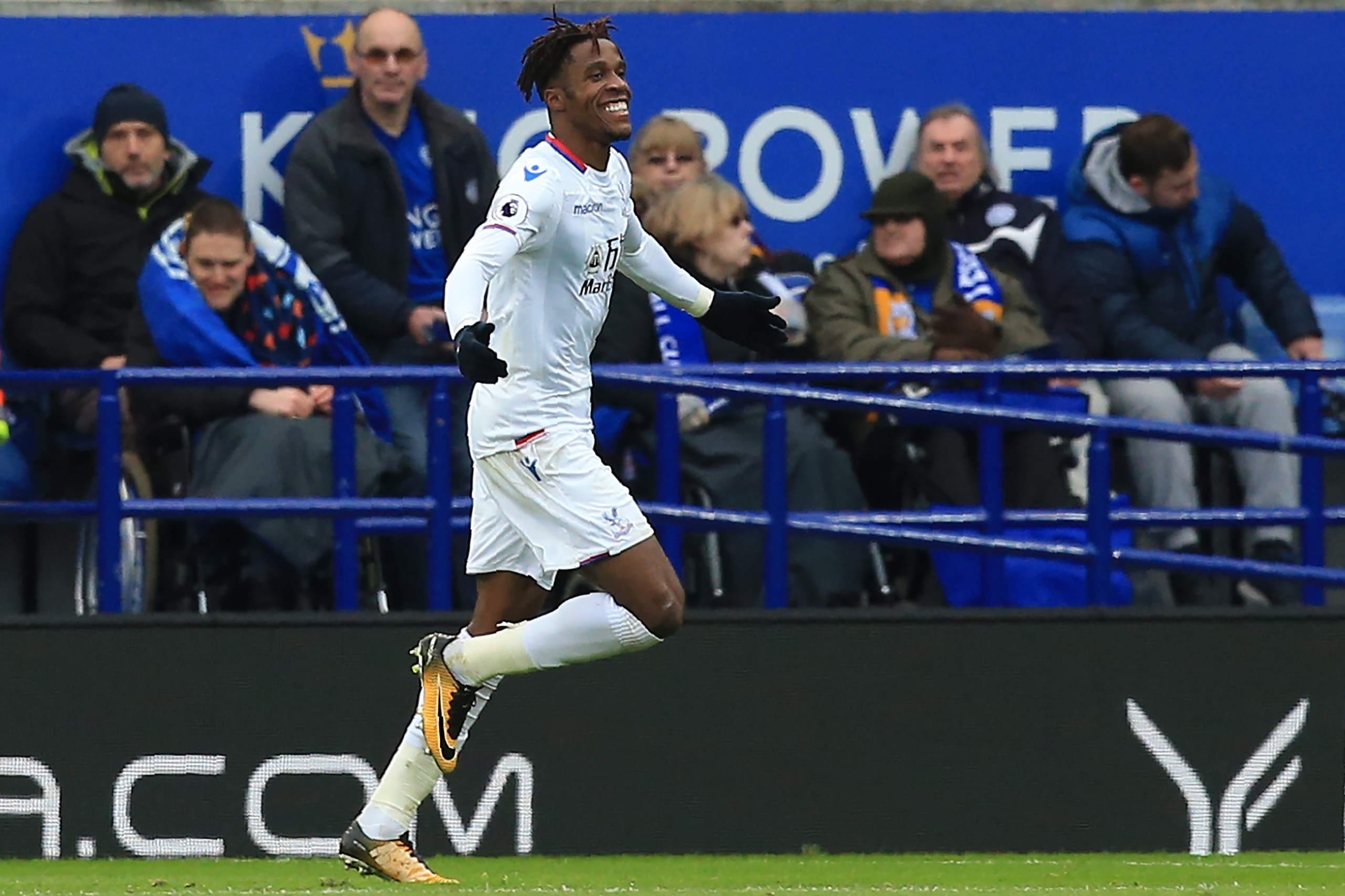 Crystal Palace's Ivorian striker Wilfried Zaha celebrates after scoring their second goal during the English Premier League football match between Leicester City and Crystal Palace at King Power Stadium in Leicester, central England on December 16, 2017. Crystal Palace's Ivorian striker Wilfried Zaha celebrates after scoring their second goal during the English Premier League football match between Leicester City and Crystal Palace at King Power Stadium in Leicester, central England on December 16, 2017.