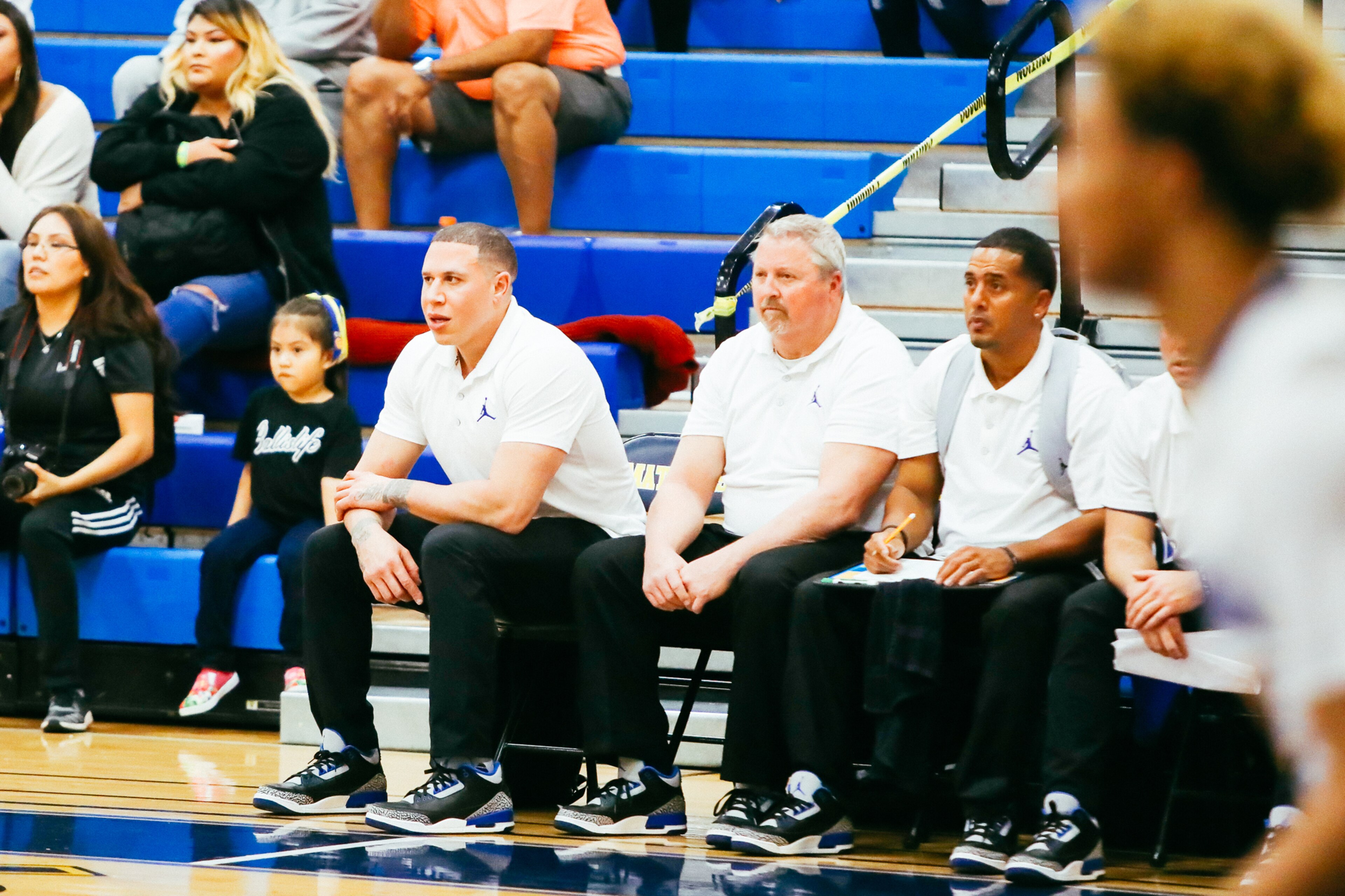Mike Bibby, left, watches his team.