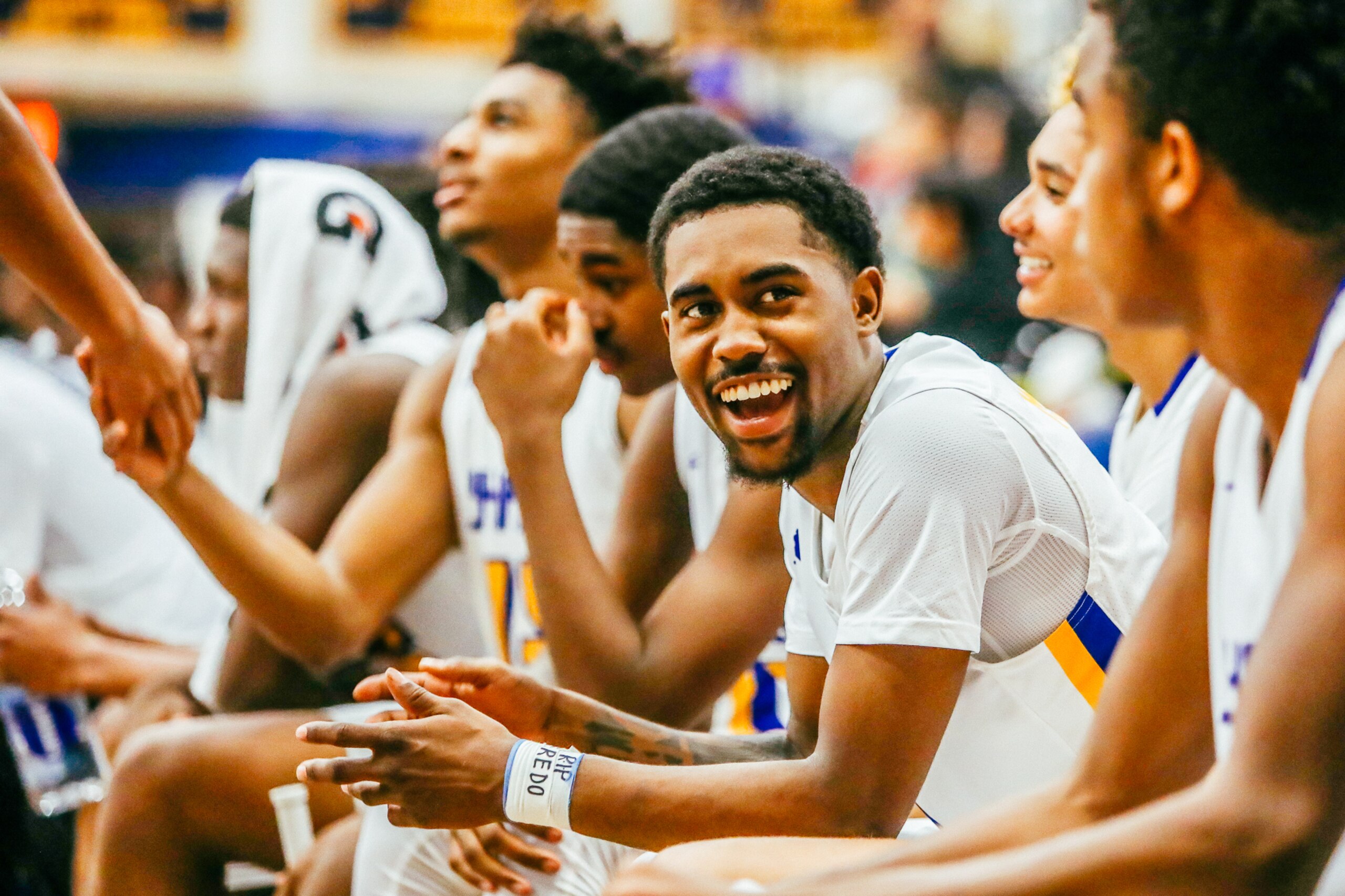 Jovan Blackshear, center, cracks a smile.