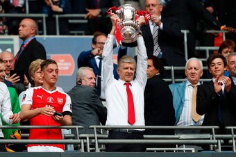 Arsenal's French manager Arsene Wenger lifts the FA Cup trophy after their win over Chelsea in the English FA Cup final football match between Arsenal and Chelsea at Wembley stadium in London on May 27, 2017.
Aaron Ramsey scored a 79th-minute header to ea