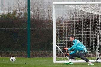 Chelsea's Belgian goalkeeper Thibaut Courtois practices his saves during a training session at Chelsea's Cobham training facility in Stoke D'Abernon, southwest of London on February 19, 2018, on the eve of their UEFA Champions League round of 16 football 