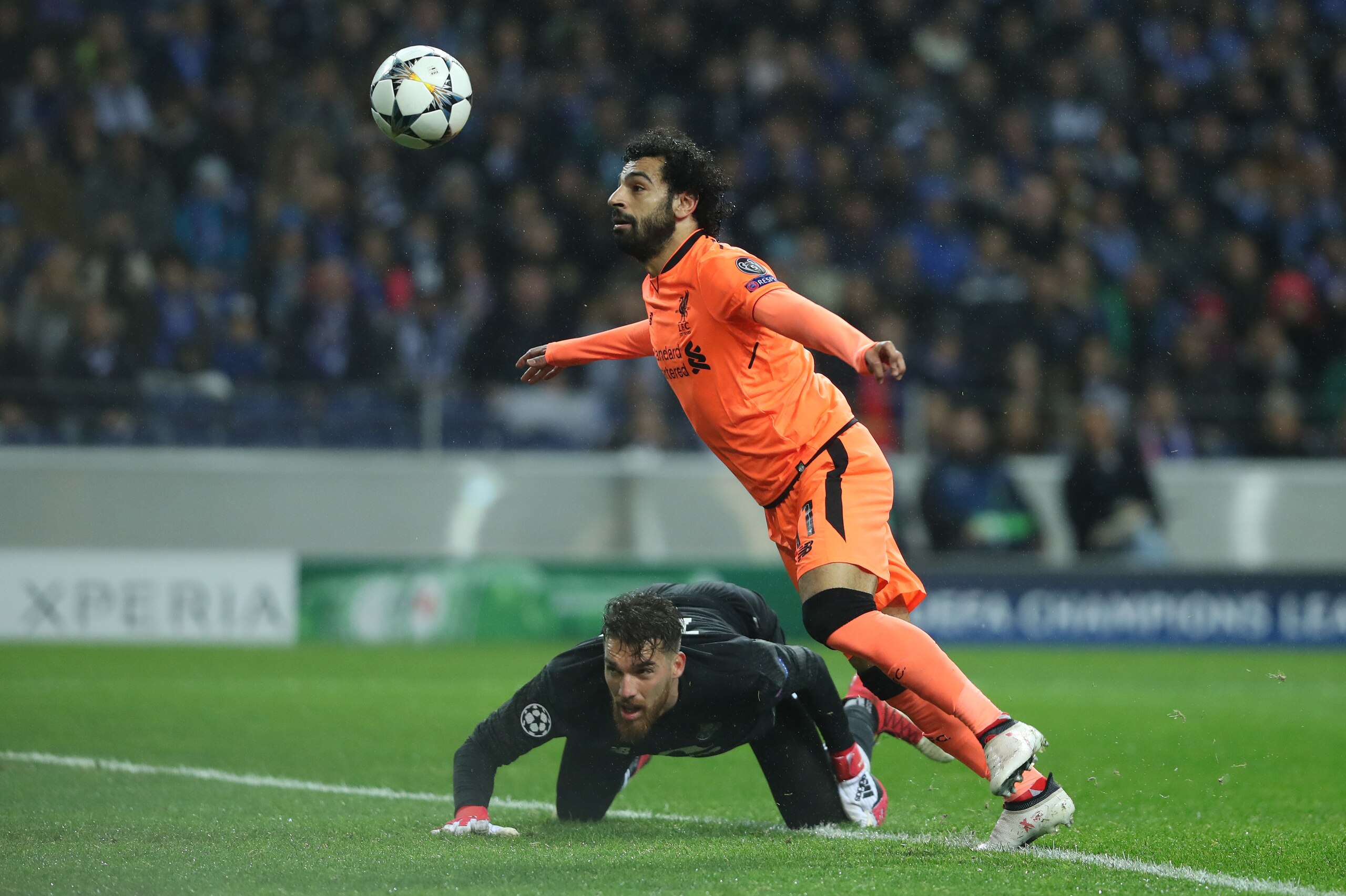 PORTO, PORTUGAL - FEBRUARY 14: FC Porto's Jose Sa (L) in action against Liverpool's  Mohammed Salah (R), during during round of 16 UEFA Champions League, first leg soccer match, Fc Porto - Liverpool Fc held at Estadio Dragao on February 14, 2018  in Porto