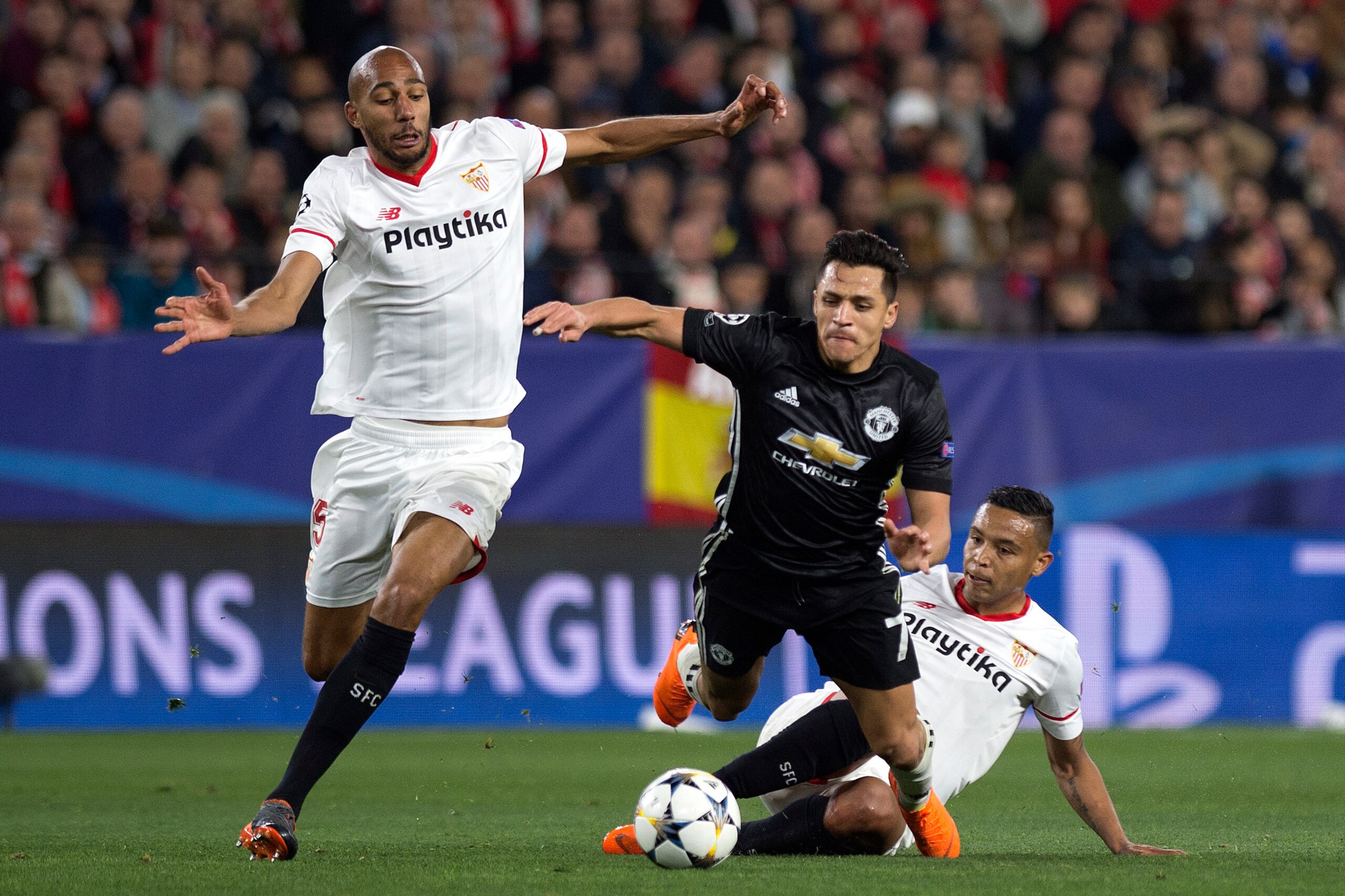Manchester United's Chilean forward Alexis Sanchez (C) vies with Sevilla's Colombian forward Luis Muriel (R) and French midfielder Steven N'Zonzi during the UEFA Champions League round of 16 first leg football match Sevilla FC against Manchester United at Manchester United's Chilean forward Alexis Sanchez (C) vies with Sevilla's Colombian forward Luis Muriel (R) and French midfielder Steven N'Zonzi during the UEFA Champions League round of 16 first leg football match Sevilla FC against Manchester United at