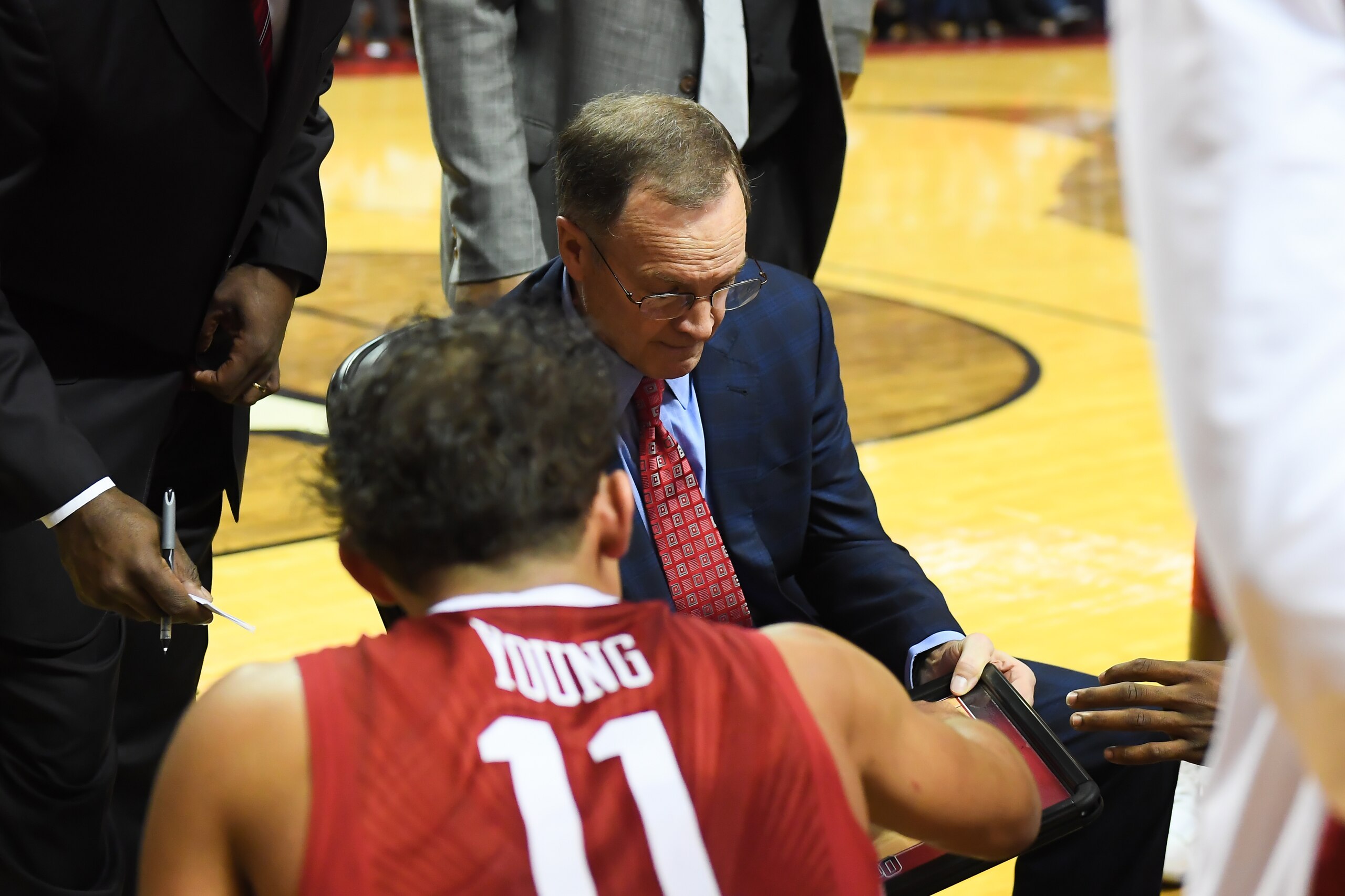 LUBBOCK, TX - FEBRUARY 13: Head coach Lon Kruger and Trae Young #11 of the Oklahoma Sooners discuss strategy at a time out during the game against the Texas Tech Red Raiders on February 13, 2018 at United Supermarket Arena in Lubbock, Texas. Texas Tech de