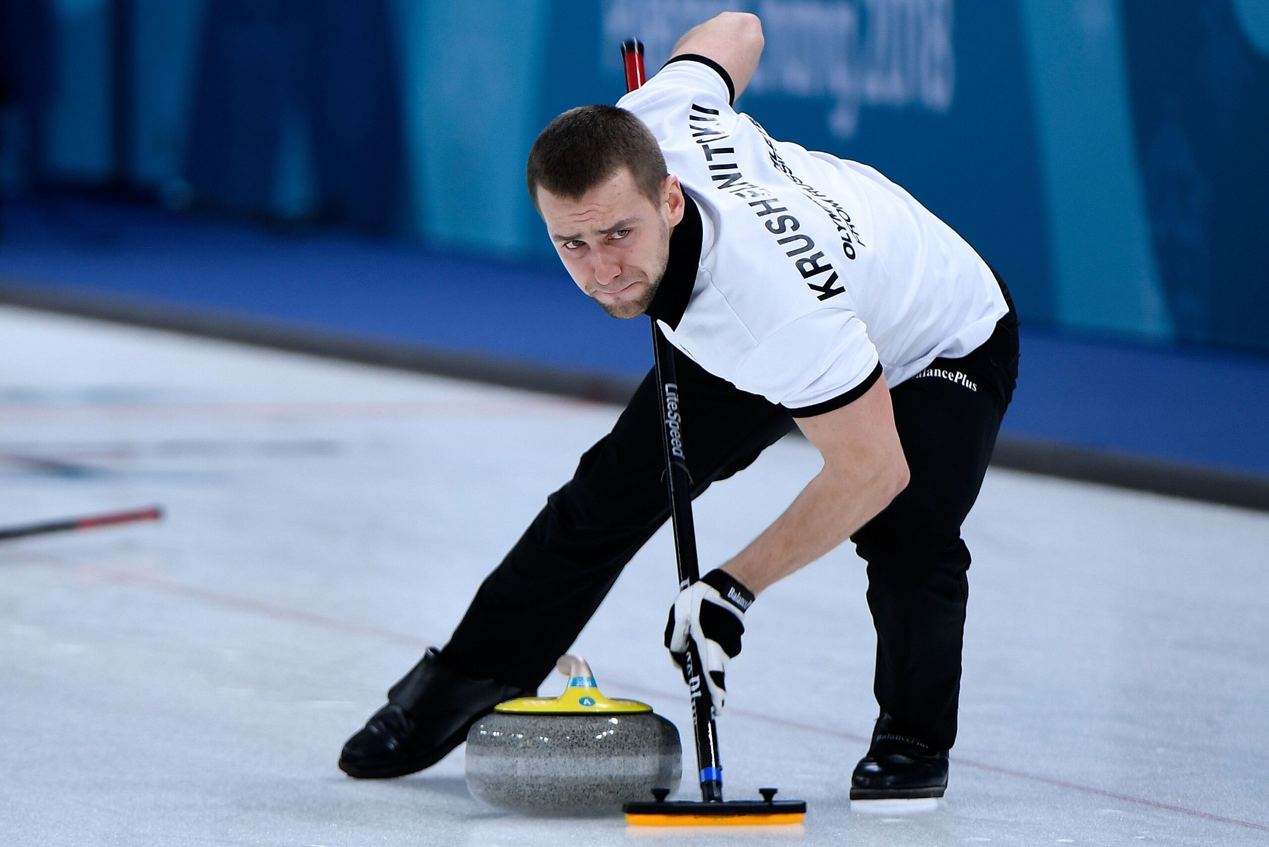 Photo dated on February 8, 2018 shows Russia's Aleksandr Krushelnitckii brushes the ice surface during the curling mixed doubles round robin session between the US and the Olympic Athletes from Russia during the Pyeongchang 2018 Winter Olympic Games at th