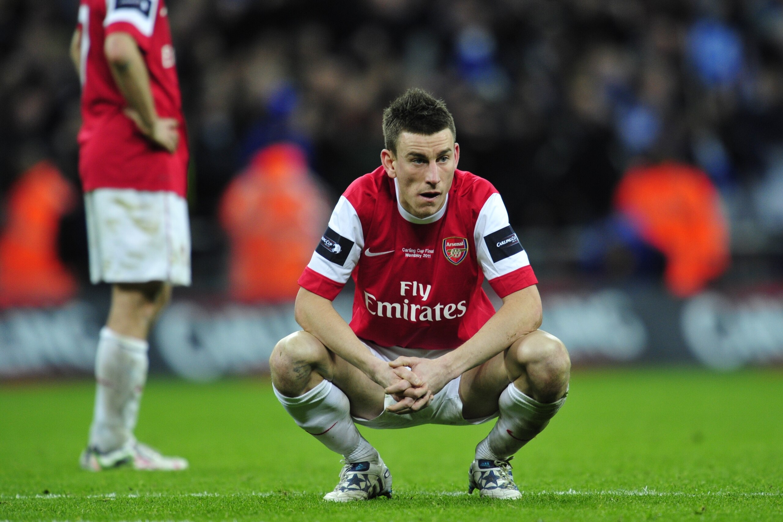 Arsenal's French defender Laurent Koscielny  looks dejected at the end of the Carling Cup final football match between Arsenal and Birmingham at the Wembley Stadium in London on February 27, 2011. Birmingham City won 2-1.  AFP PHOTO/GLYN KIRKFOR EDITORIAL