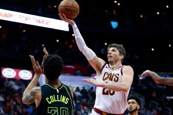 Kyle Korver driving on the Atlanta Hawks' John Collins.