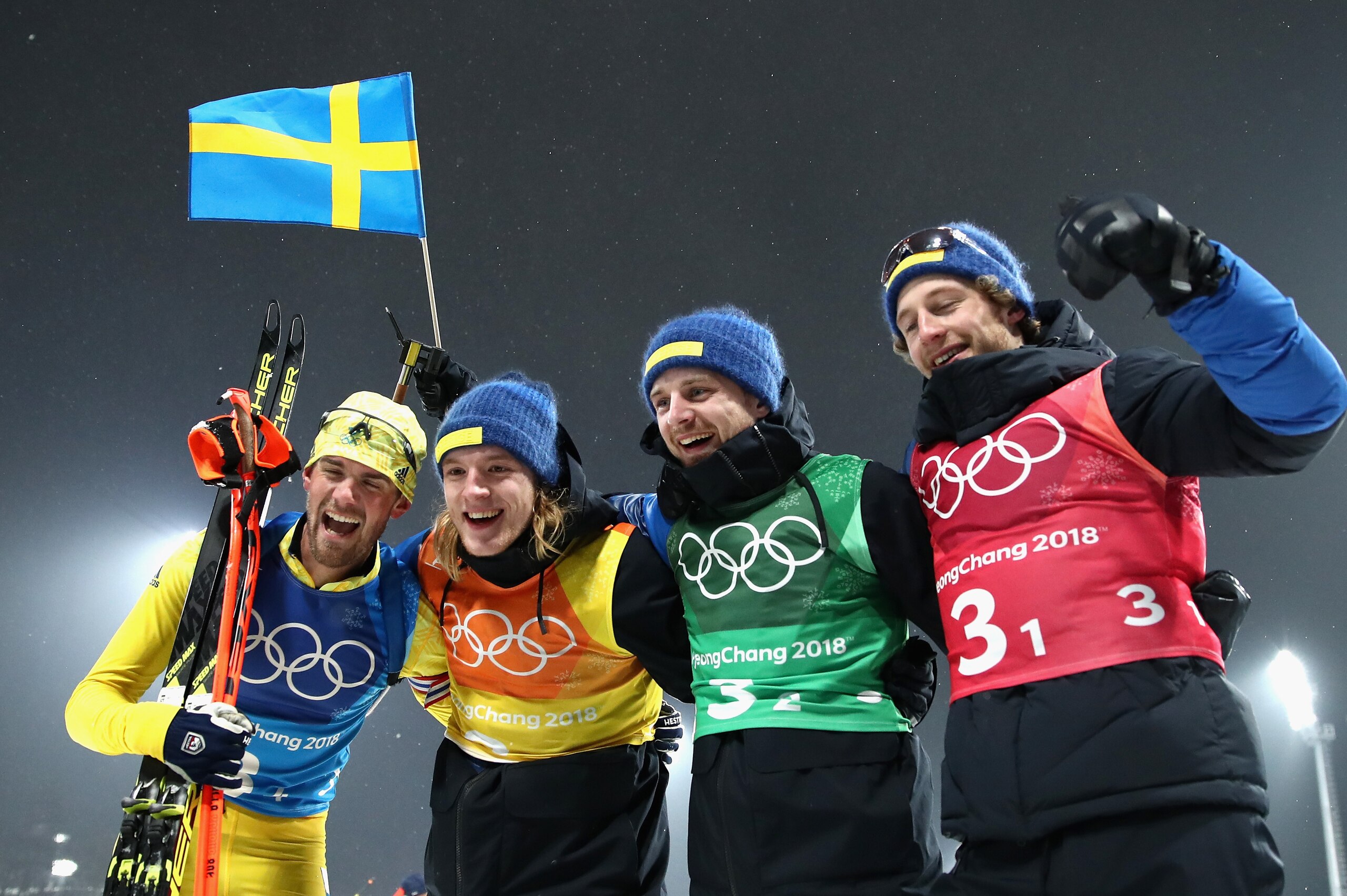 PYEONGCHANG-GUN, SOUTH KOREA - FEBRUARY 23:  (L-R) Fredrik Lindstroem, Sebastian Samuelsson, Jesper Nelin and Peppe Femling of Sweden celebrate winning the gold medal during the Men's 4x7.5km Biathlon Relay on day 14 of the PyeongChang 2018 Winter Olympic
