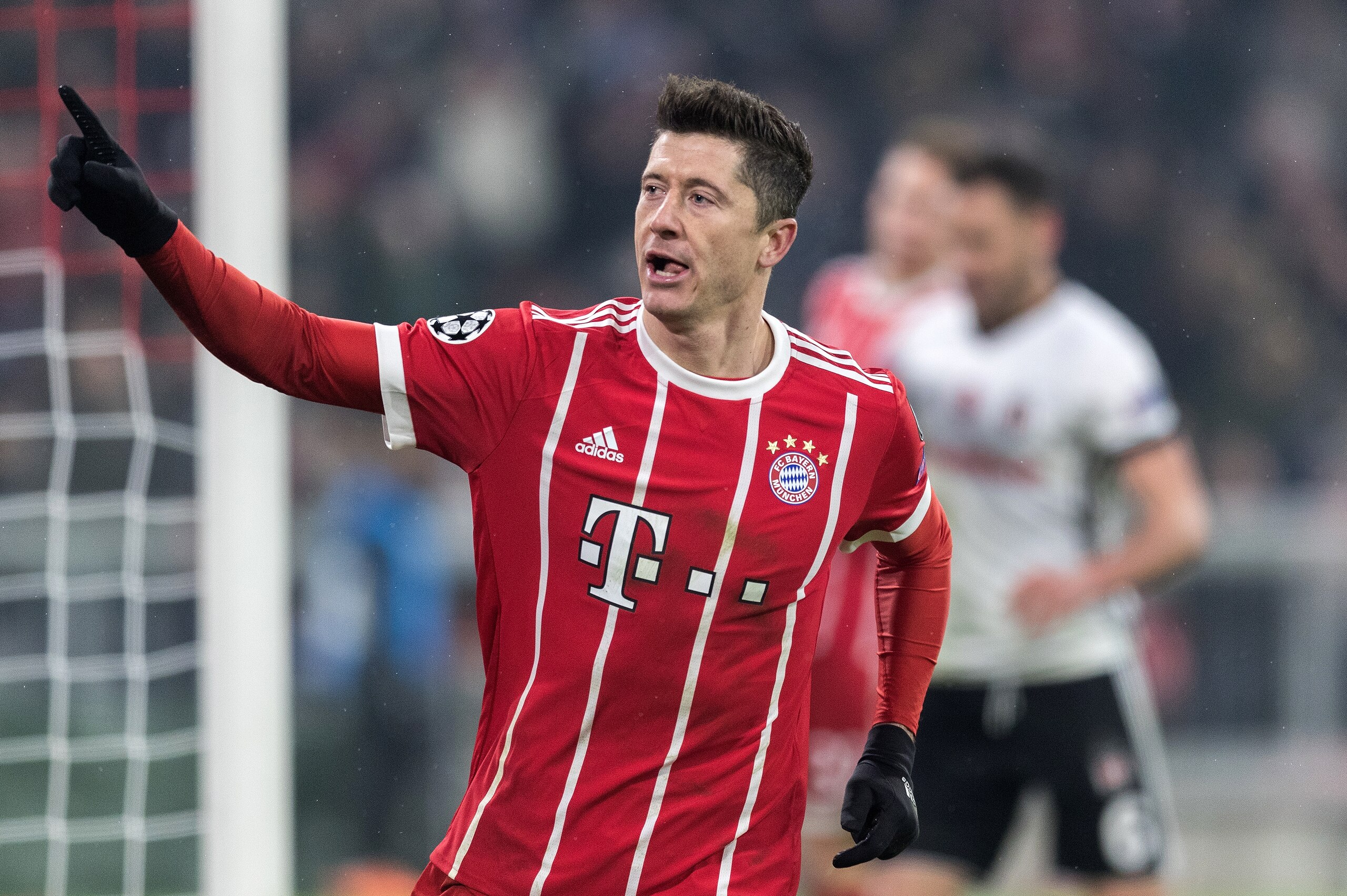 MUNICH, GERMANY - FEBRUARY 20:  Robert Lewandowski of FC Bayern Muenchen celebrates after scoring his team's fourth goal during the UEFA Champions League Round of 16 First Leg match between Bayern Muenchen and Besiktas at Allianz Arena on February 20, 201