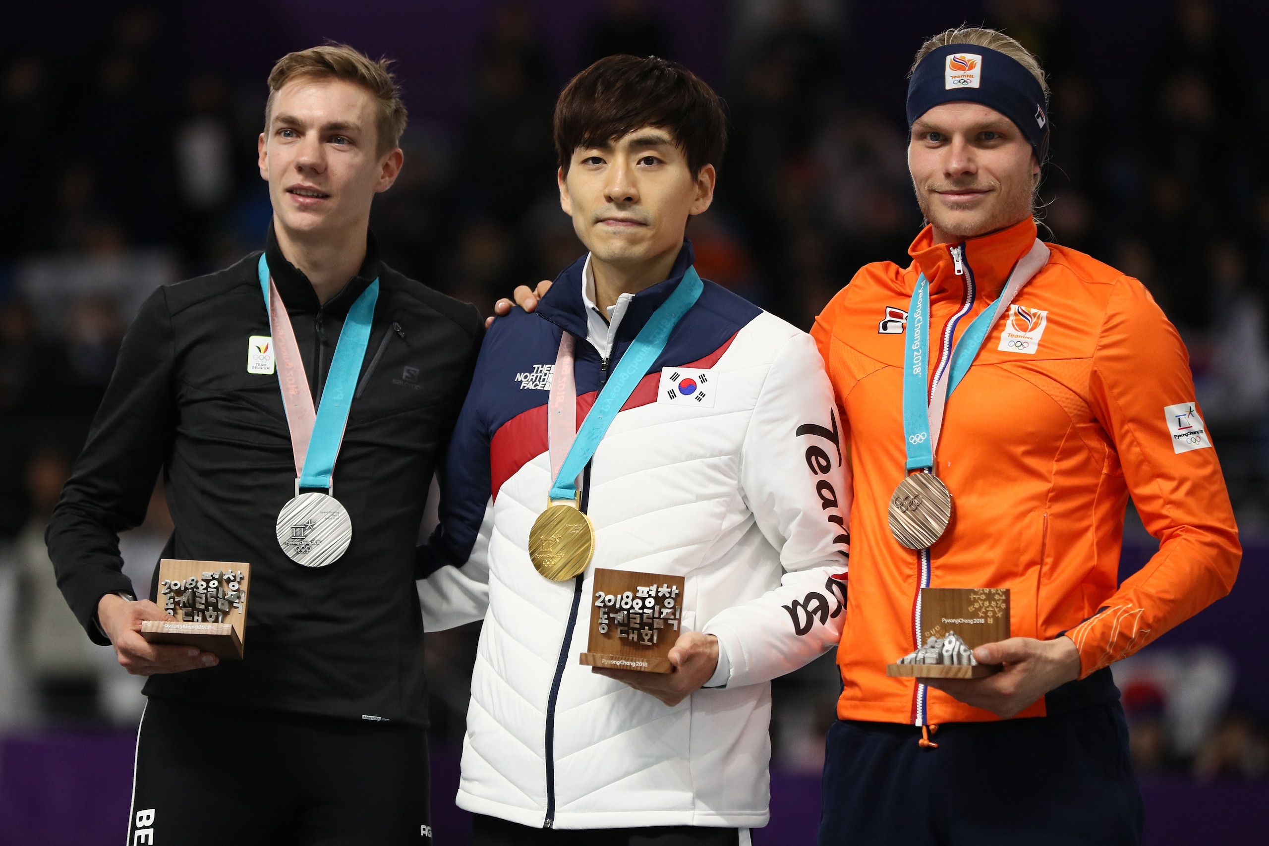 GANGNEUNG, SOUTH KOREA - FEBRUARY 24:  (L-R) Silver medalist Bart Swings of Germany, gold medalist Seung-Hoon Lee of Korea and bronze medalist Koen Verweij of Netherlands stand on the podium during the medal ceremony after the Men's Speed Skating Mass Sta