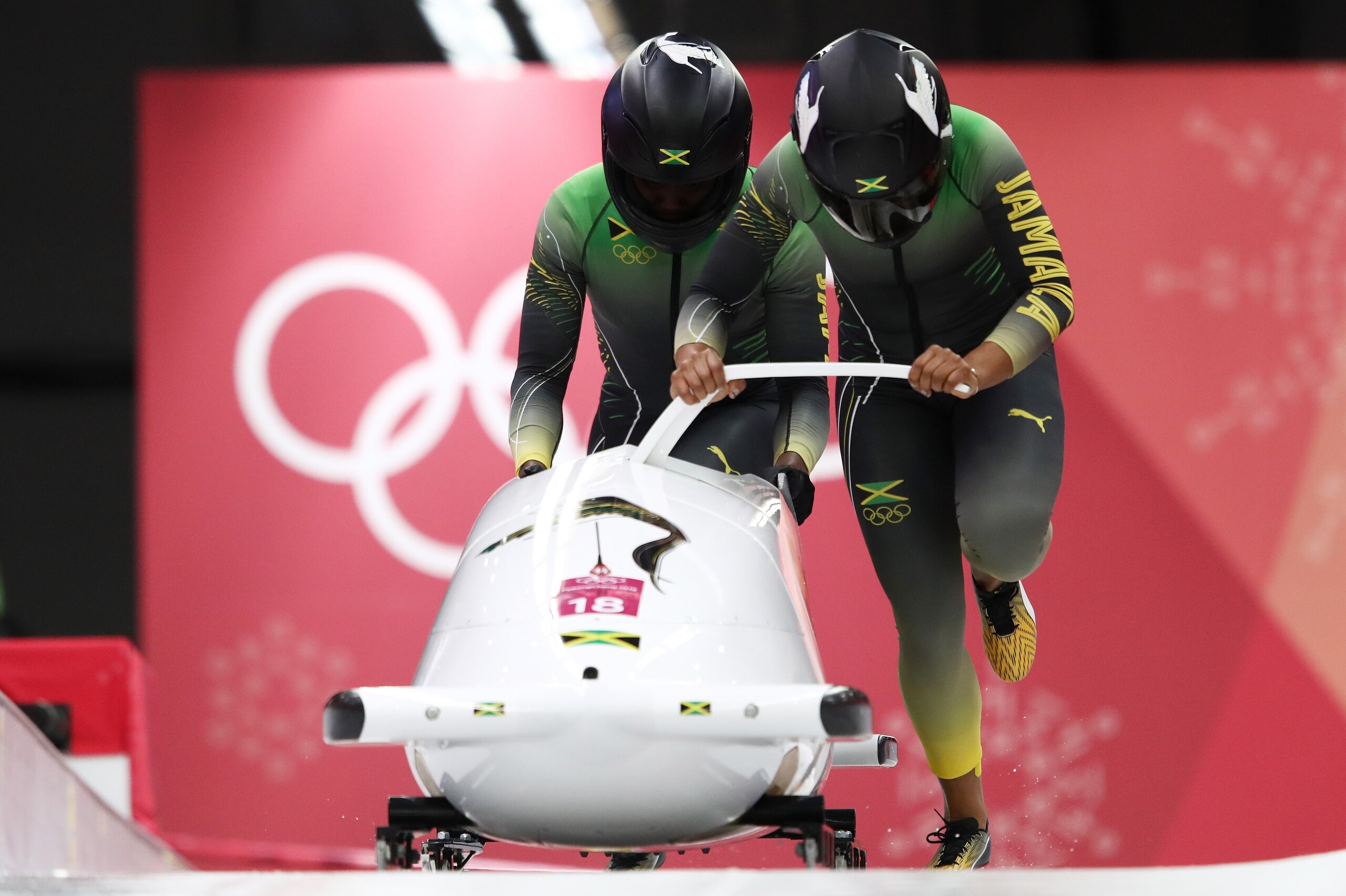 PYEONGCHANG-GUN, SOUTH KOREA - FEBRUARY 21:  Jazmine Fenlator-Victorian and Carrie Russell of Jamaica slide  during the Women's Bobsleigh heats on day twelve of the PyeongChang 2018 Winter Olympic Games at the Olympic Sliding Centre on February 21, 2018 i