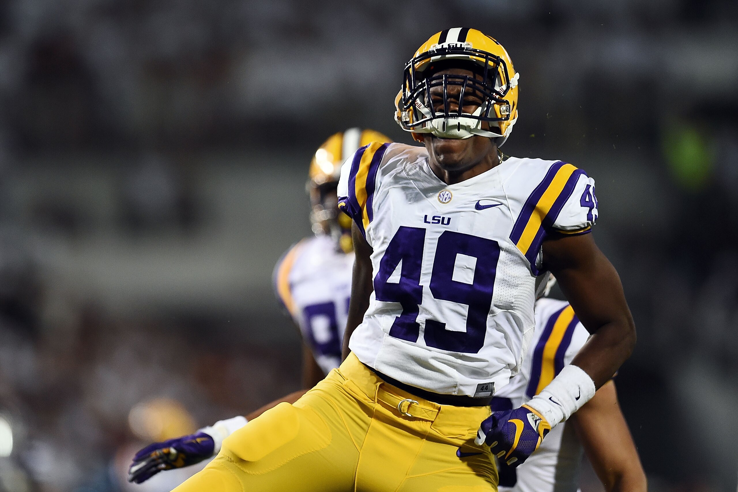 STARKVILLE, MS - SEPTEMBER 12:  Arden Key #49 of the LSU Tigers reacts to a sack during a game against the Mississippi State Bulldogs at Davis Wade Stadium on September 12, 2015 in Starkville, Mississippi.  LSU won the game 21-19.  (Photo by Stacy Revere/