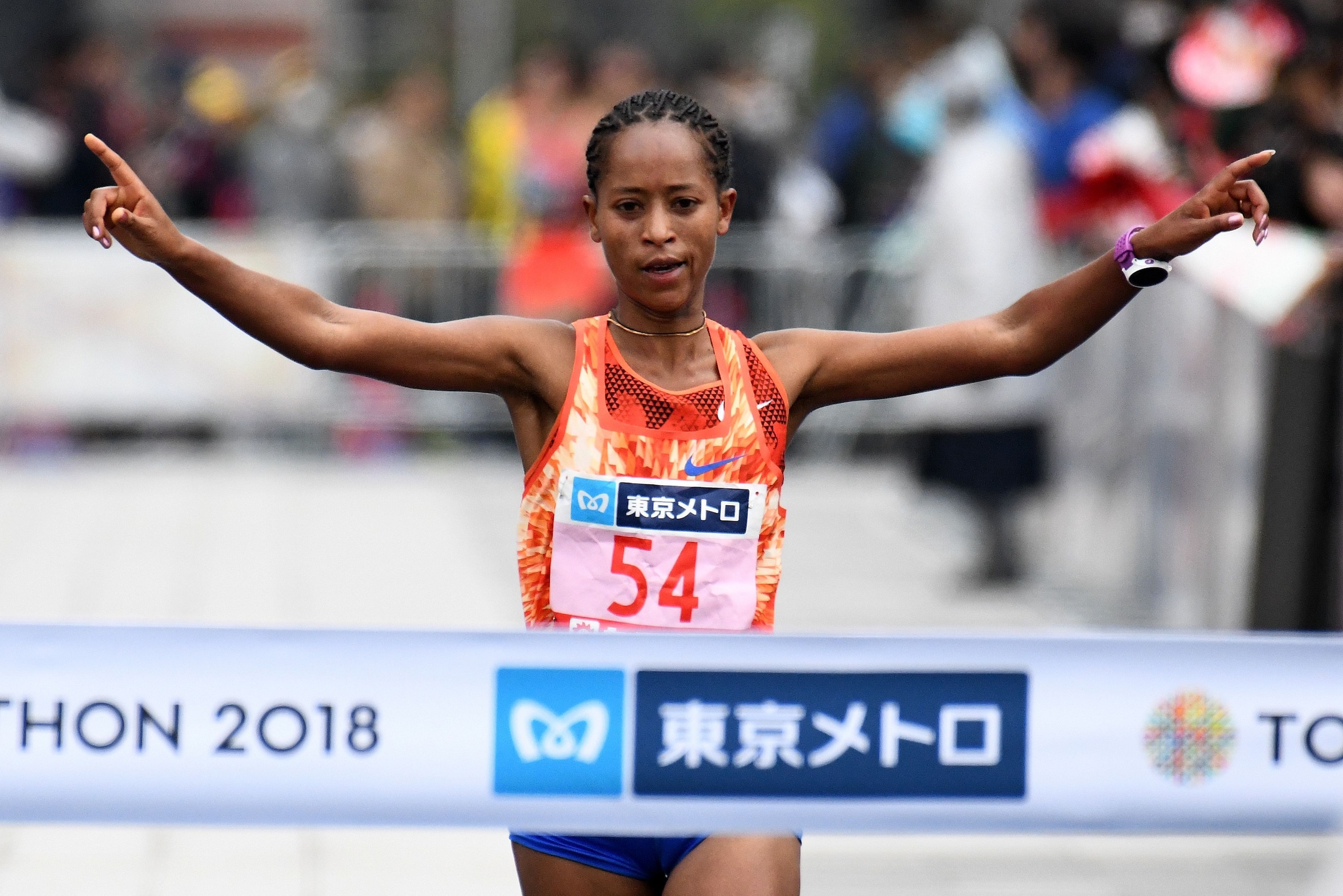 Birhane Dibaba of Ethiopia crosses the finish line with the best women's time during the Tokyo Marathon in Tokyo on February 25, 2018. / AFP PHOTO / Toru YAMANAKA        (Photo credit should read TORU YAMANAKA/AFP/Getty Images)