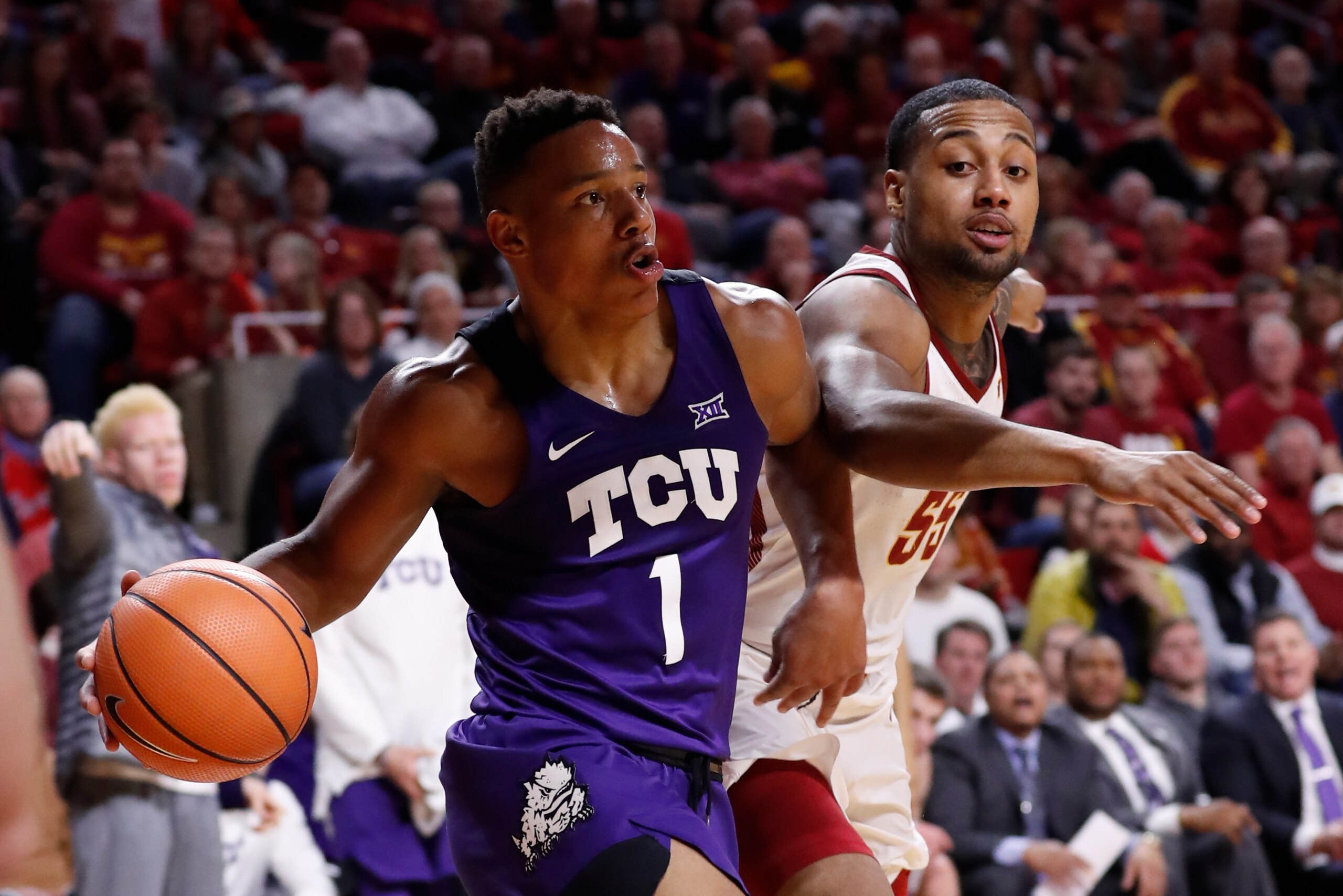 AMES, IA - FEBRUARY 21: Desmond Bane #1 of the TCU Horned Frogs drives with the ball as Jeff Beverly #55 of the Iowa State Cyclones puts on pressure in the second half of play at Hilton Coliseum on February 21, 2018 in Ames, Iowa. TCU Horned Frogs won 89-