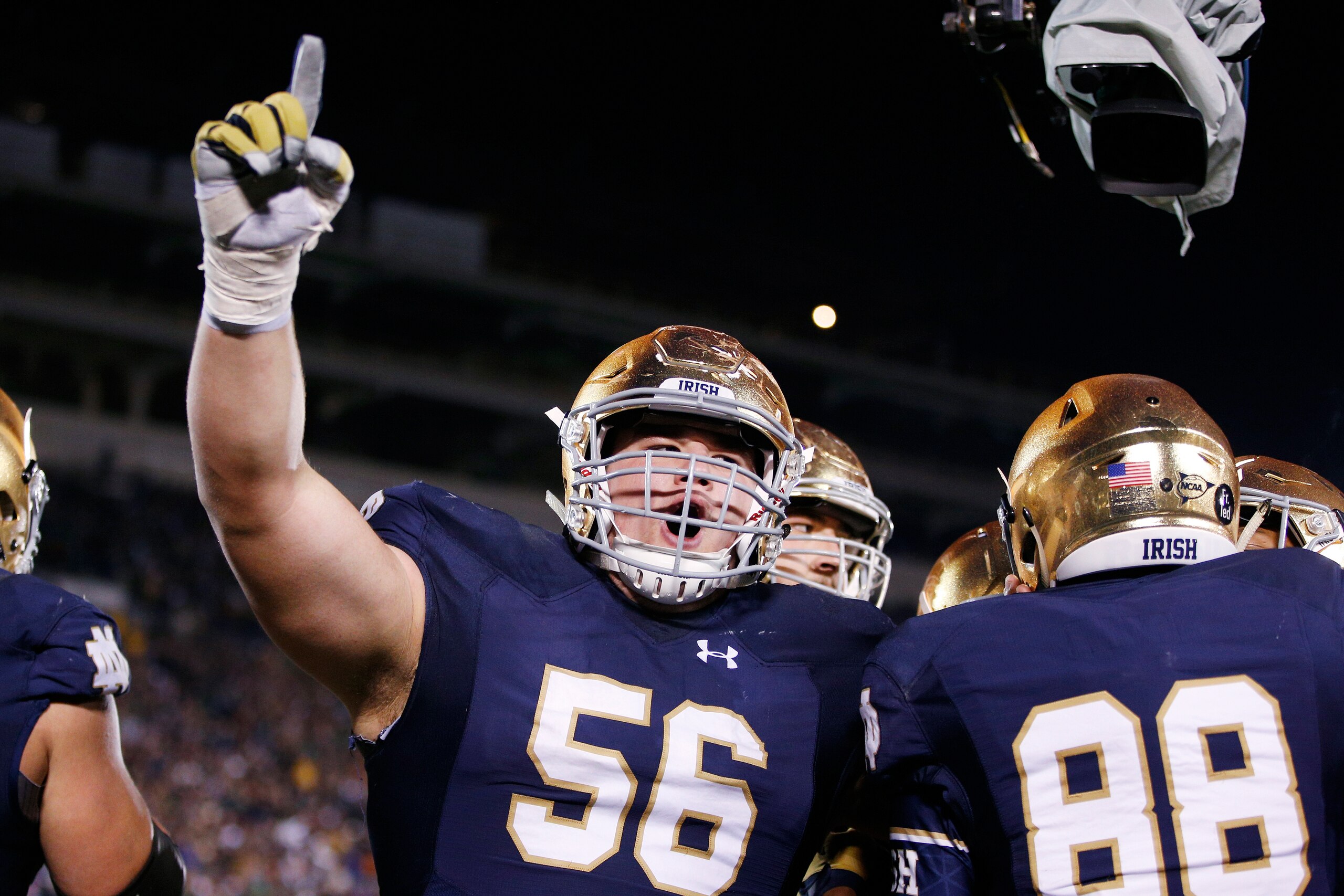 SOUTH BEND, IN - OCTOBER 17: Quenton Nelson #56 of the Notre Dame Fighting Irish celebrates after a 10-yard touchdown reception by Corey Robinson against the USC Trojans in the fourth quarter of the game at Notre Dame Stadium on October 17, 2015 in South 