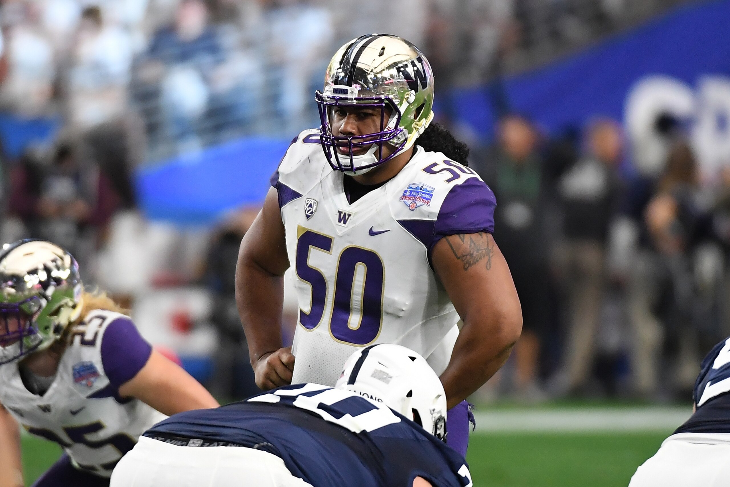 GLENDALE, AZ - DECEMBER 30:  Vita Vea #50 of the Washington Huskies looks across the line of scrimmage prior to a play against the Penn State Nittany Lions during the Playstation Fiesta Bowl at University of Phoenix Stadium on December 30, 2017 in Glendal