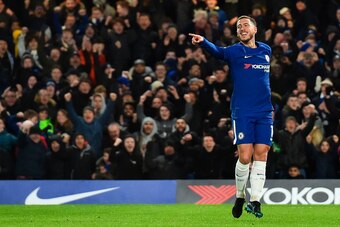 Chelsea's Belgian midfielder Eden Hazard celebrates scoring the opening goal during the English Premier League football match between Chelsea and West Bromwich Albion at Stamford Bridge in London on February 12, 2018. / AFP PHOTO / Glyn KIRK / RESTRICTED 