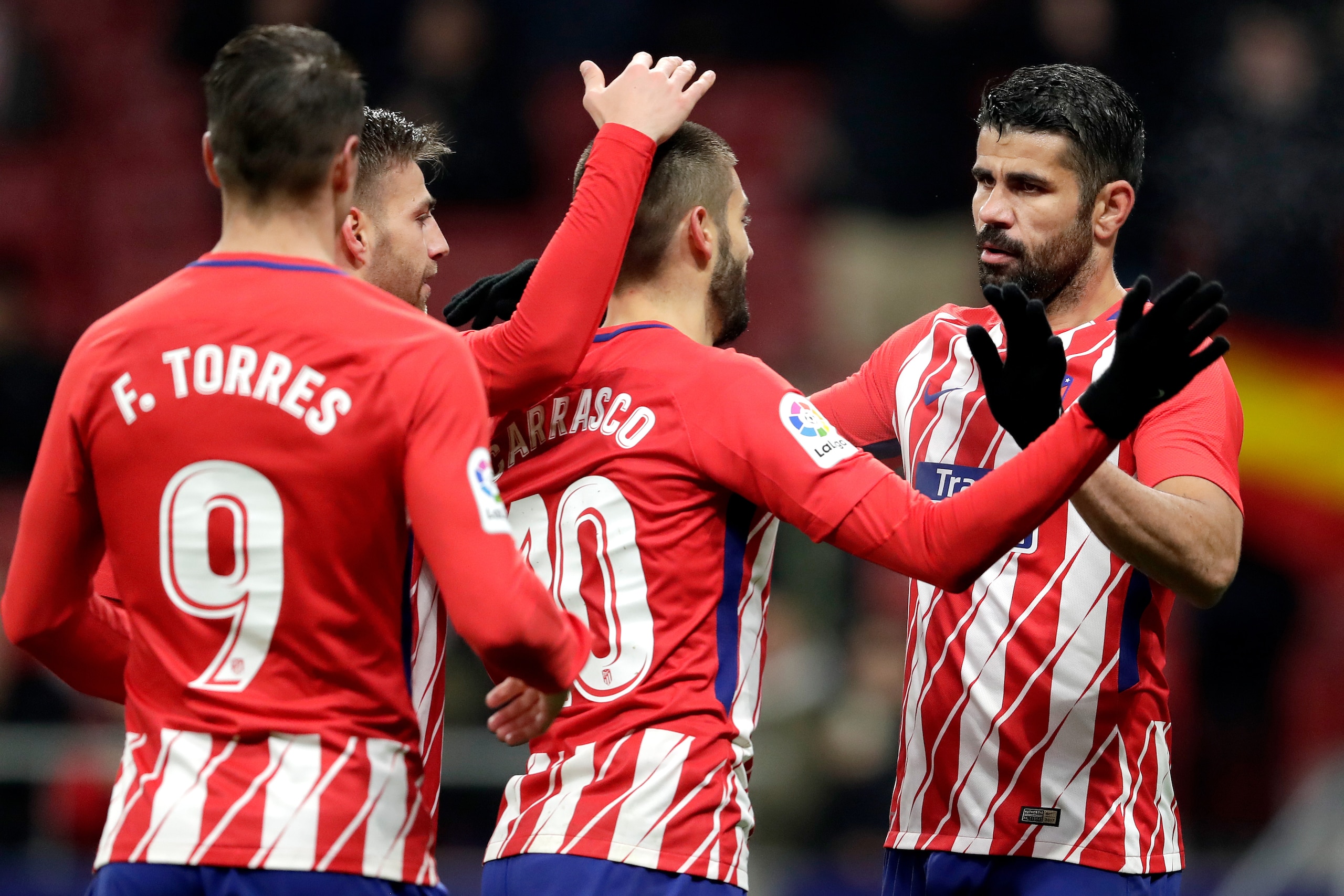 , SPAIN - JANUARY 9: Yannick Carrasco of Atletico Madrid celebrates 1-0 with Sergio Gonzalez Teston of Atletico Madrid, Fernando Torres of Atletico Madrid, Diego Costa of Atletico Madrid  during the Spanish Copa del Rey  match between Atletico Madrid v Ll